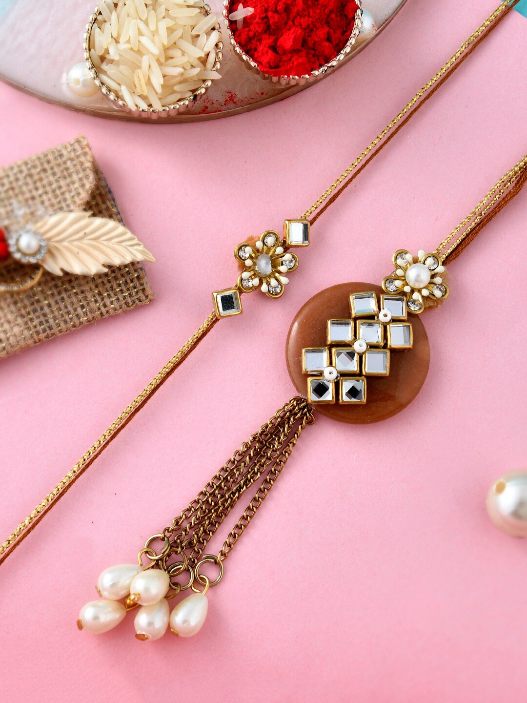 Aapno Rajasthan Unisex Set Of 2 Pearl & Kundan Rakhi With Roli, Rice & Greeting Card, Gold
Aapno Rajasthan Unisex Set Of 2 Pearl & Kundan Rakhi With Roli, Rice & Greeting Card, Gold