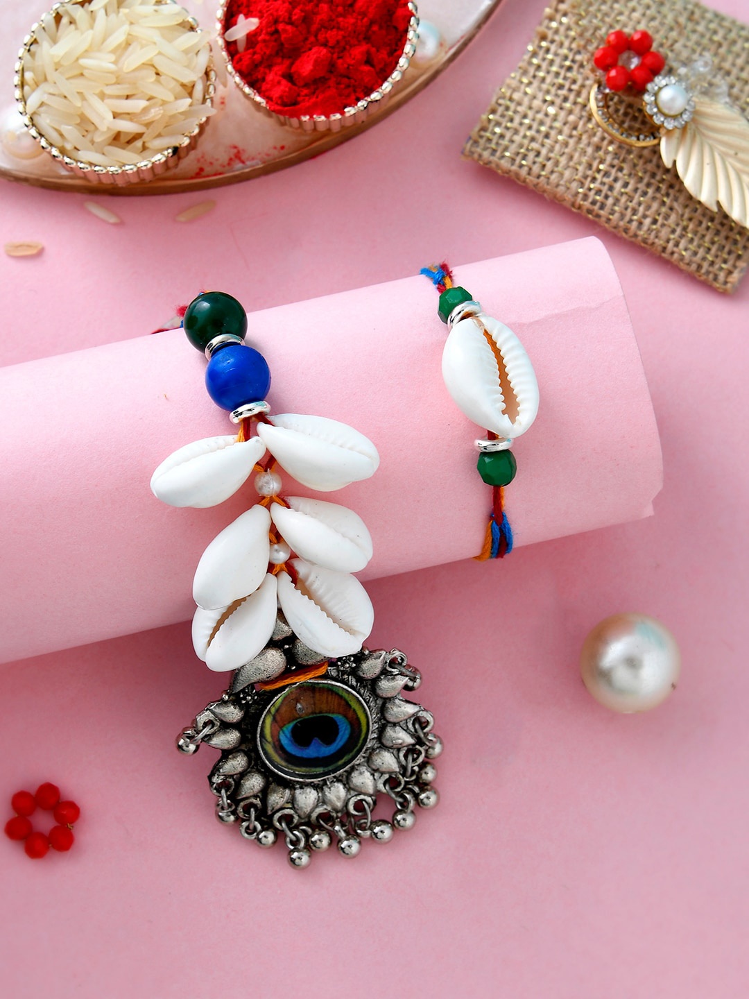 Aapno Rajasthan Set of 2 Beaded Peacock Feather Rakhis With Roli, Chawal & Card, White
Aapno Rajasthan Set of 2 Beaded Peacock Feather Rakhis With Roli, Chawal & Card, White