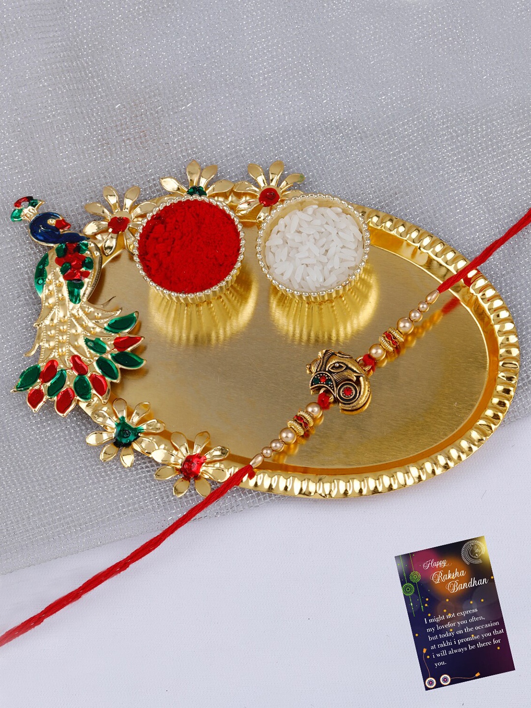 Silver Shine Ganesh Charm Rakhi With Roli Chawal & 1 Greeting Card Kankawati Pooja Thali, Red
Silver Shine Ganesh Charm Rakhi With Roli Chawal & 1 Greeting Card Kankawati Pooja Thali, Red