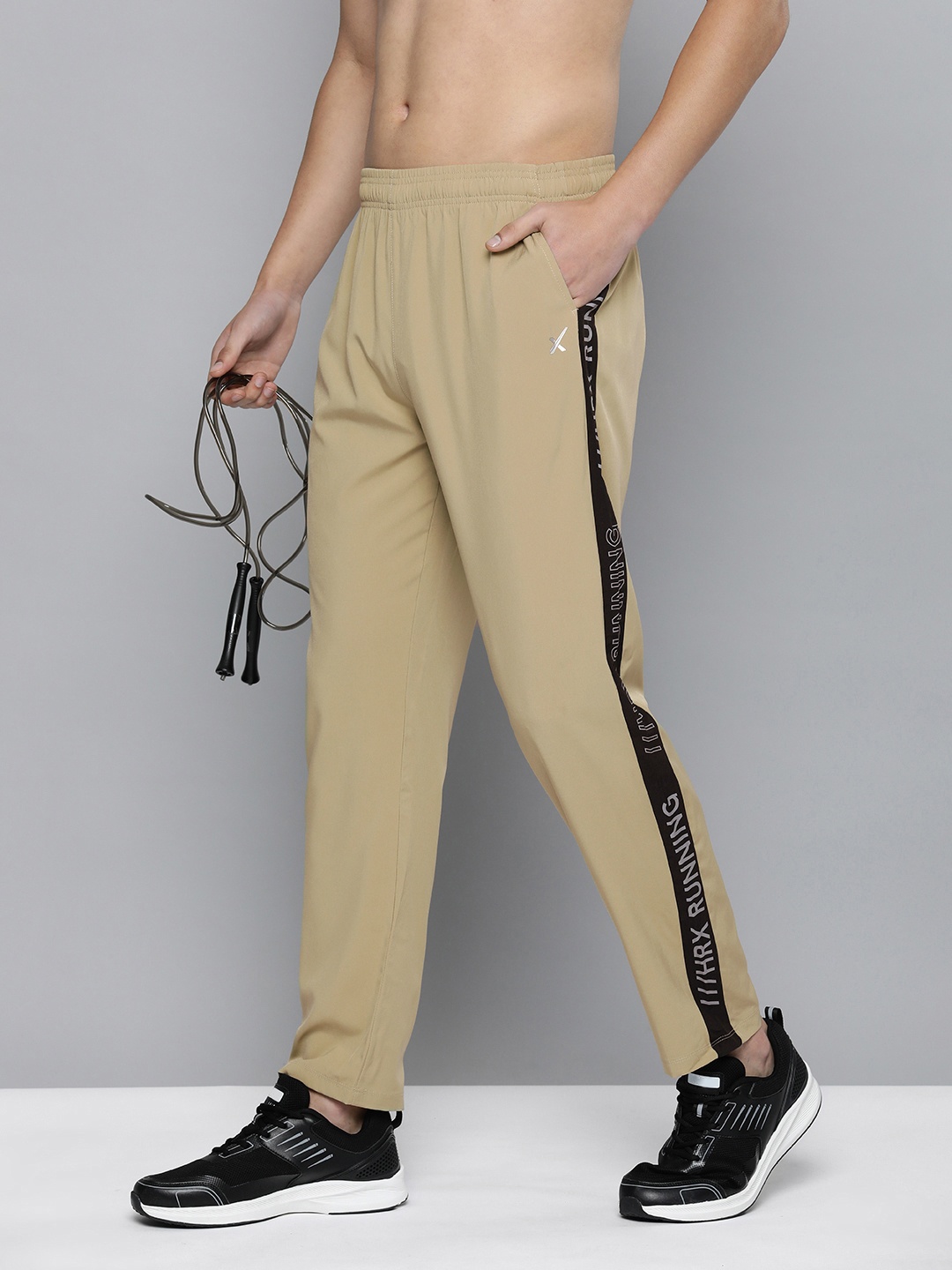 HRX by Hrithik Roshan Men Solid Rapid-Dry Running Track Pants With Side Stripes, Beige
HRX by Hrithik Roshan Men Solid Rapid-Dry Running Track Pants With Side Stripes, Beige