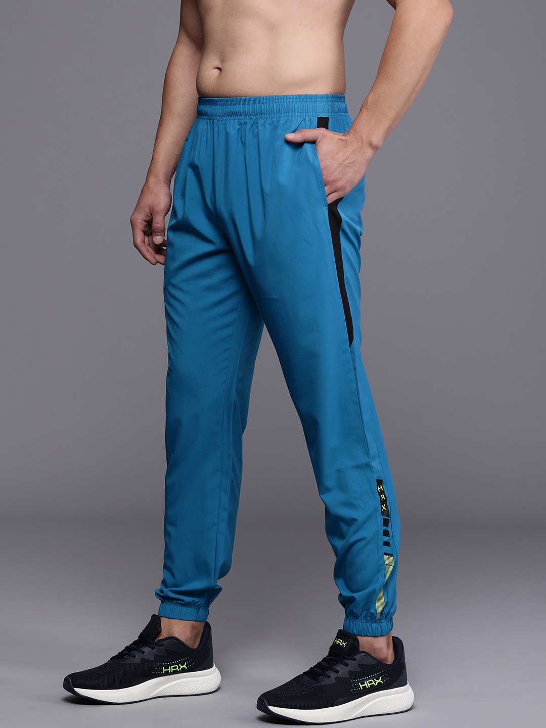 HRX by Hrithik Roshan Men Solid Mid-Rise Rapid-Dry Training Joggers With Side Stripes, Blue
HRX by Hrithik Roshan Men Solid Mid-Rise Rapid-Dry Training Joggers With Side Stripes, Blue