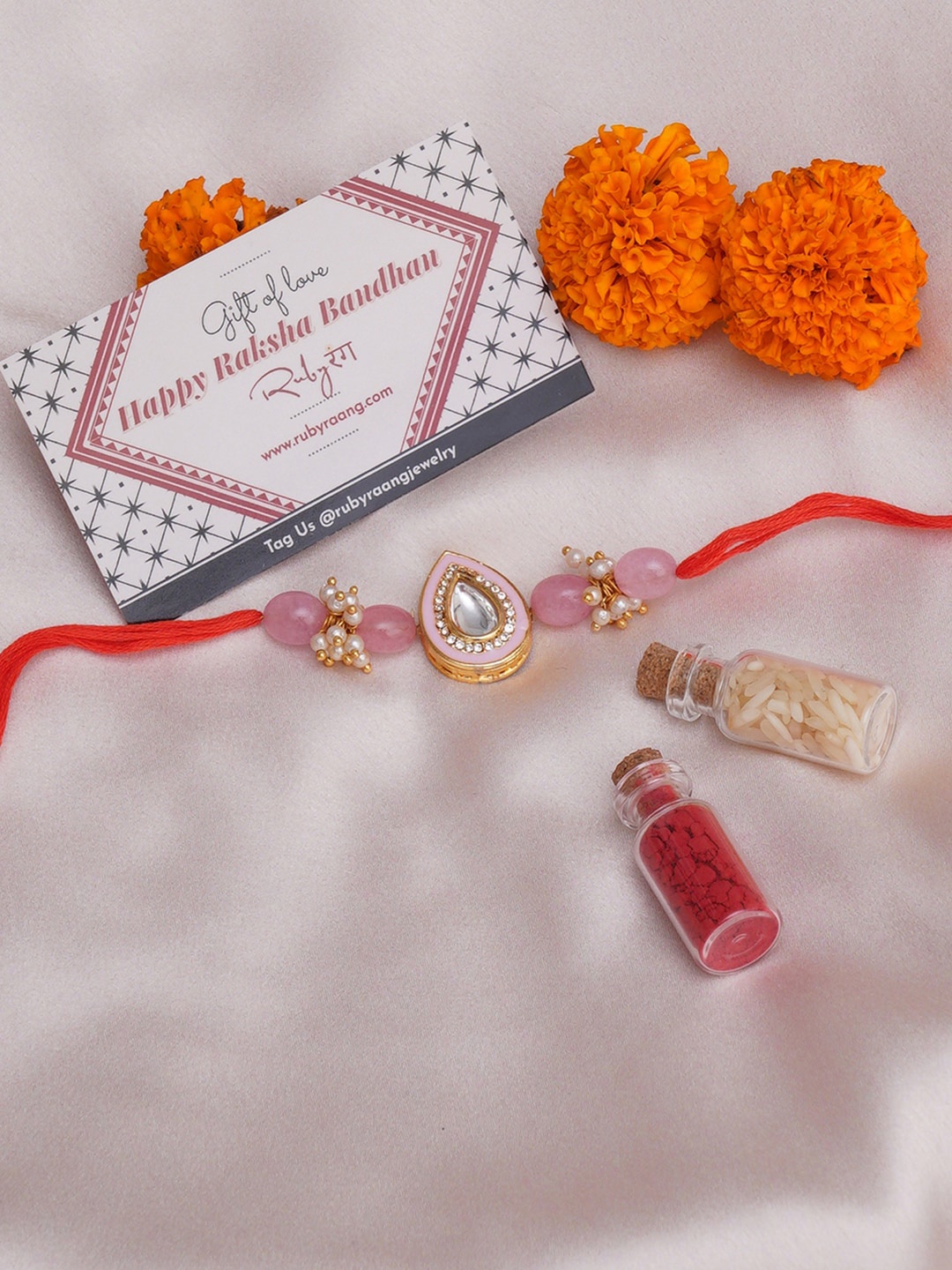 Ruby Raang Stone-Studded & Beaded Rakhi With Roli Chawal & Greeting Card Gift Box, Pink
Ruby Raang Stone-Studded & Beaded Rakhi With Roli Chawal & Greeting Card Gift Box, Pink