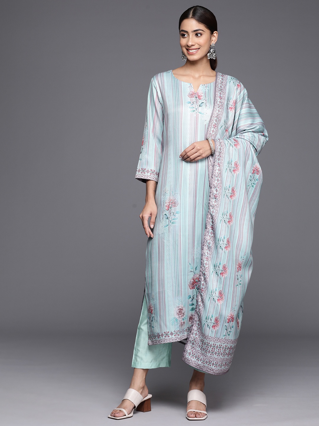 Varanga Blue Floral Printed & Striped Round Neck Straight Kurta with Trousers & Dupatta
Varanga Blue Floral Printed & Striped Round Neck Straight Kurta with Trousers & Dupatta