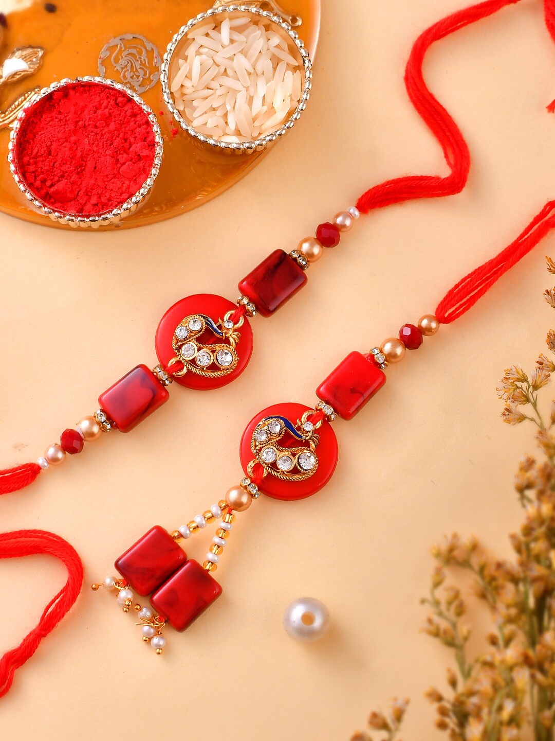 Aapno Rajasthan Set Of 2 Stone-Studded & Beaded Rakhi With Roli Rice & Greeting Card, Red
Aapno Rajasthan Set Of 2 Stone-Studded & Beaded Rakhi With Roli Rice & Greeting Card, Red