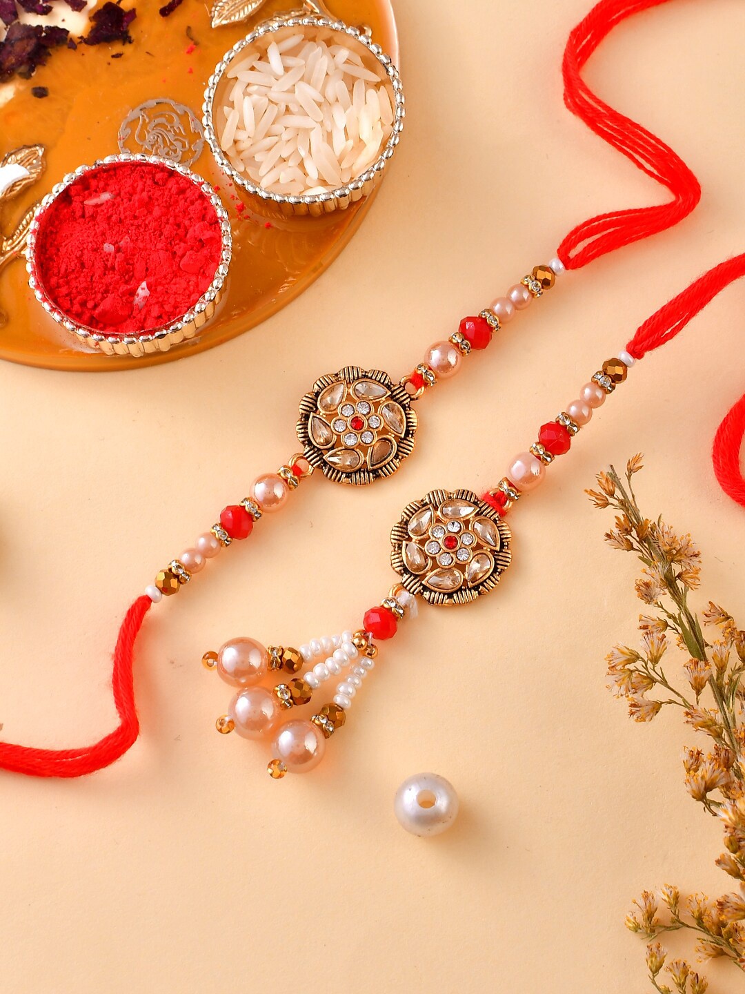 Aapno Rajasthan Set Of 2 Stone-Studded & Beaded Rakhi With Roli Rice & Greeting Card, Red
Aapno Rajasthan Set Of 2 Stone-Studded & Beaded Rakhi With Roli Rice & Greeting Card, Red
