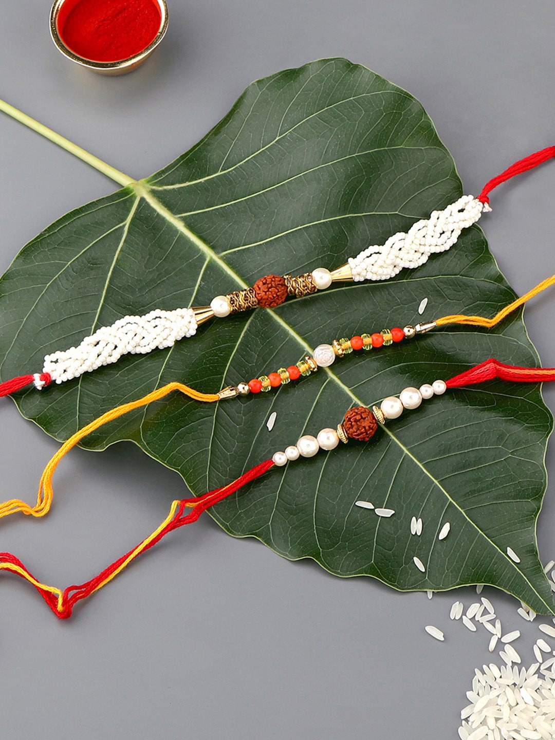 AccessHer Set Of 3 Pearl Beaded Rudraksh Charm Rakhi With Roli, Rice & 1 Greeting Card, White
AccessHer Set Of 3 Pearl Beaded Rudraksh Charm Rakhi With Roli, Rice & 1 Greeting Card, White