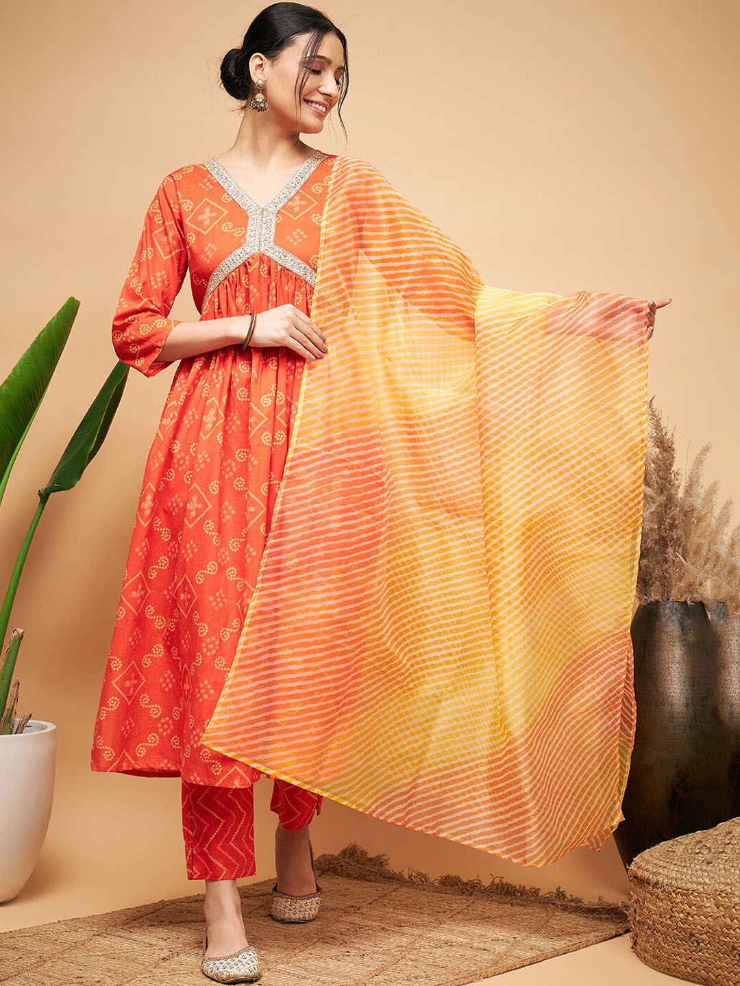 InWeave Orange Bandhani Printed Pure Cotton Empire A-Line Kurta & Trousers with Dupatta
InWeave Orange Bandhani Printed Pure Cotton Empire A-Line Kurta & Trousers with Dupatta