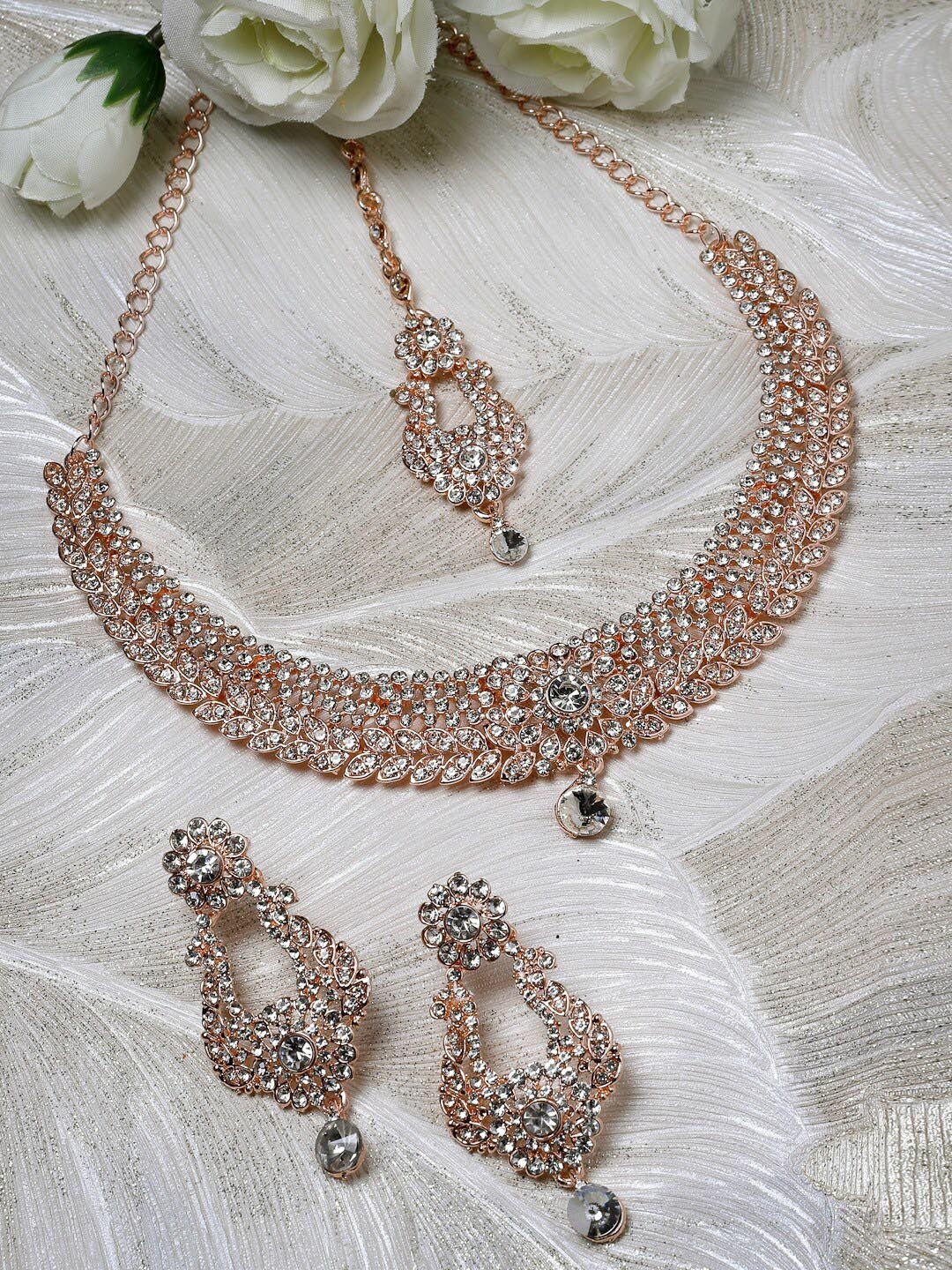 Sukkhi Rose Gold-Plated American Diamond-Studded Necklace With Earrings And Maang Tika
Sukkhi Rose Gold-Plated American Diamond-Studded Necklace With Earrings And Maang Tika