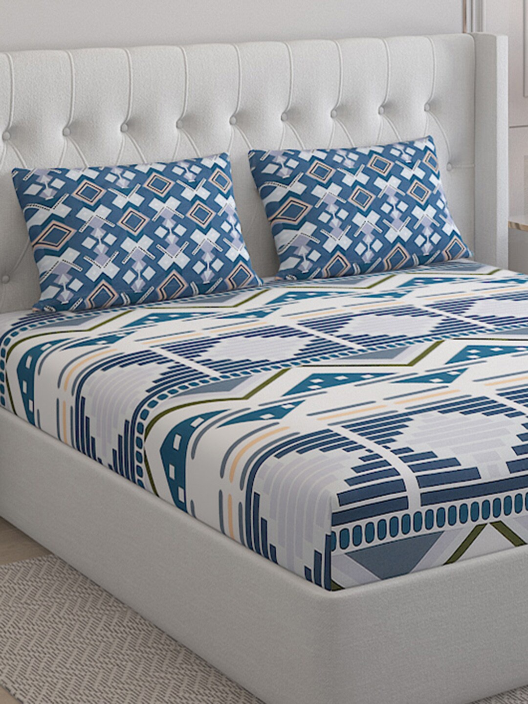 Monte Carlo Off White & Blue Geometric Pure Cotton 152 TC King Bedsheet & 2 Pillow Covers
Monte Carlo Off White & Blue Geometric Pure Cotton 152 TC King Bedsheet & 2 Pillow Covers