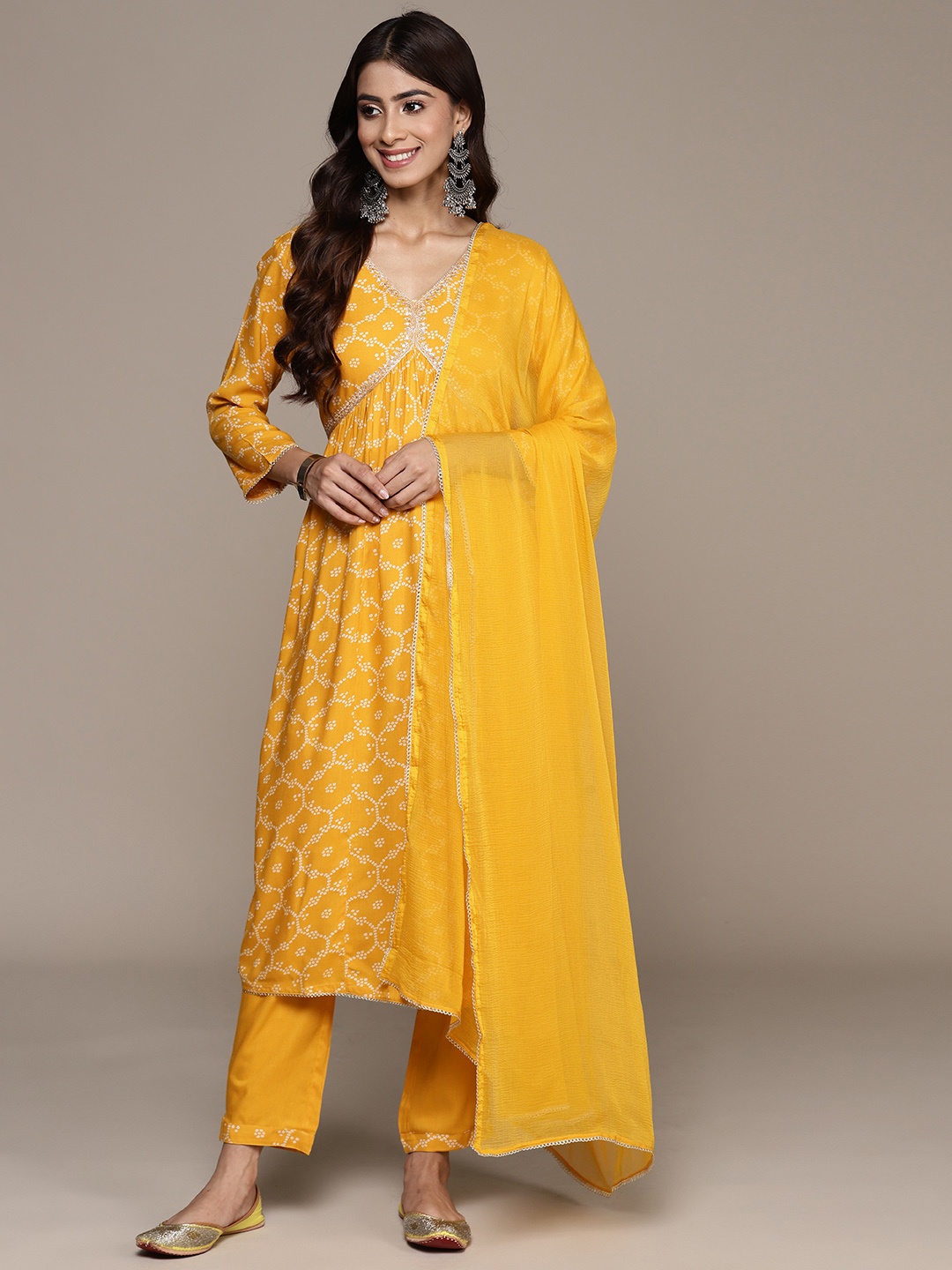 Ishin Women Bandhani Printed Regular Thread Work Kurta with Trousers & With Dupatta, Mustard
Ishin Women Bandhani Printed Regular Thread Work Kurta with Trousers & With Dupatta, Mustard