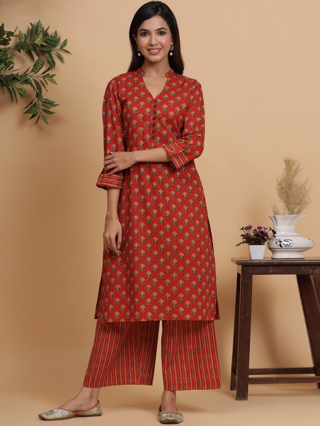 Sangria Rust Coloured Ethnic Motifs Printed Pure Cotton Straight Kurta with Palazzos
Sangria Rust Coloured Ethnic Motifs Printed Pure Cotton Straight Kurta with Palazzos