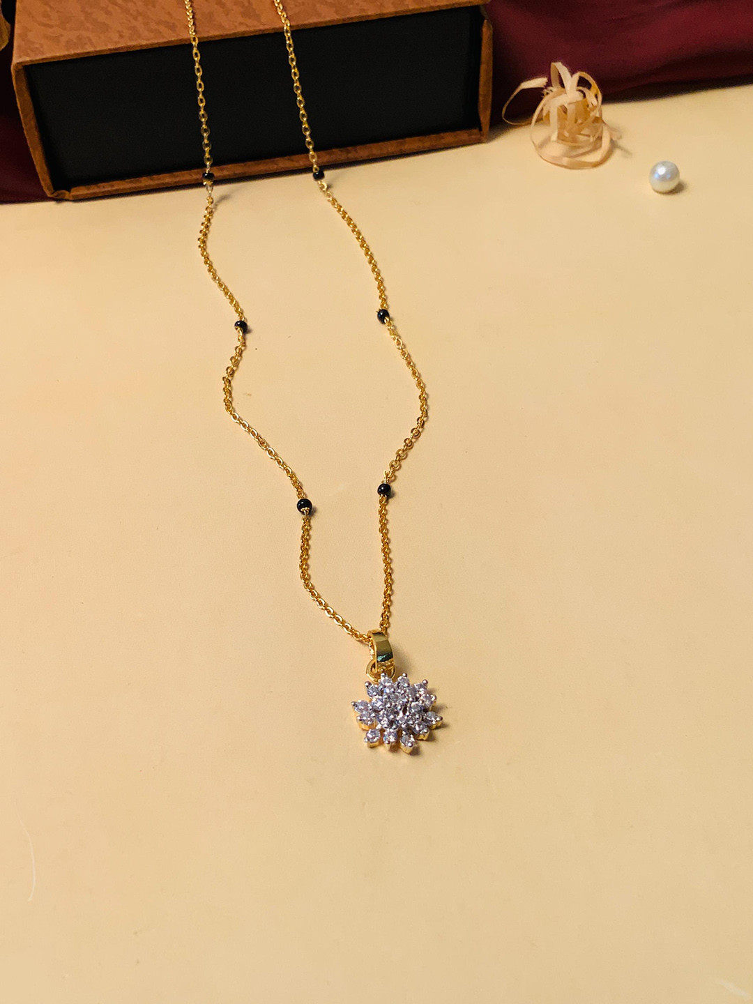 ABDESIGNS Gold-Plated American Diamond-Studded & Beaded Mangalsutra
ABDESIGNS Gold-Plated American Diamond-Studded & Beaded Mangalsutra