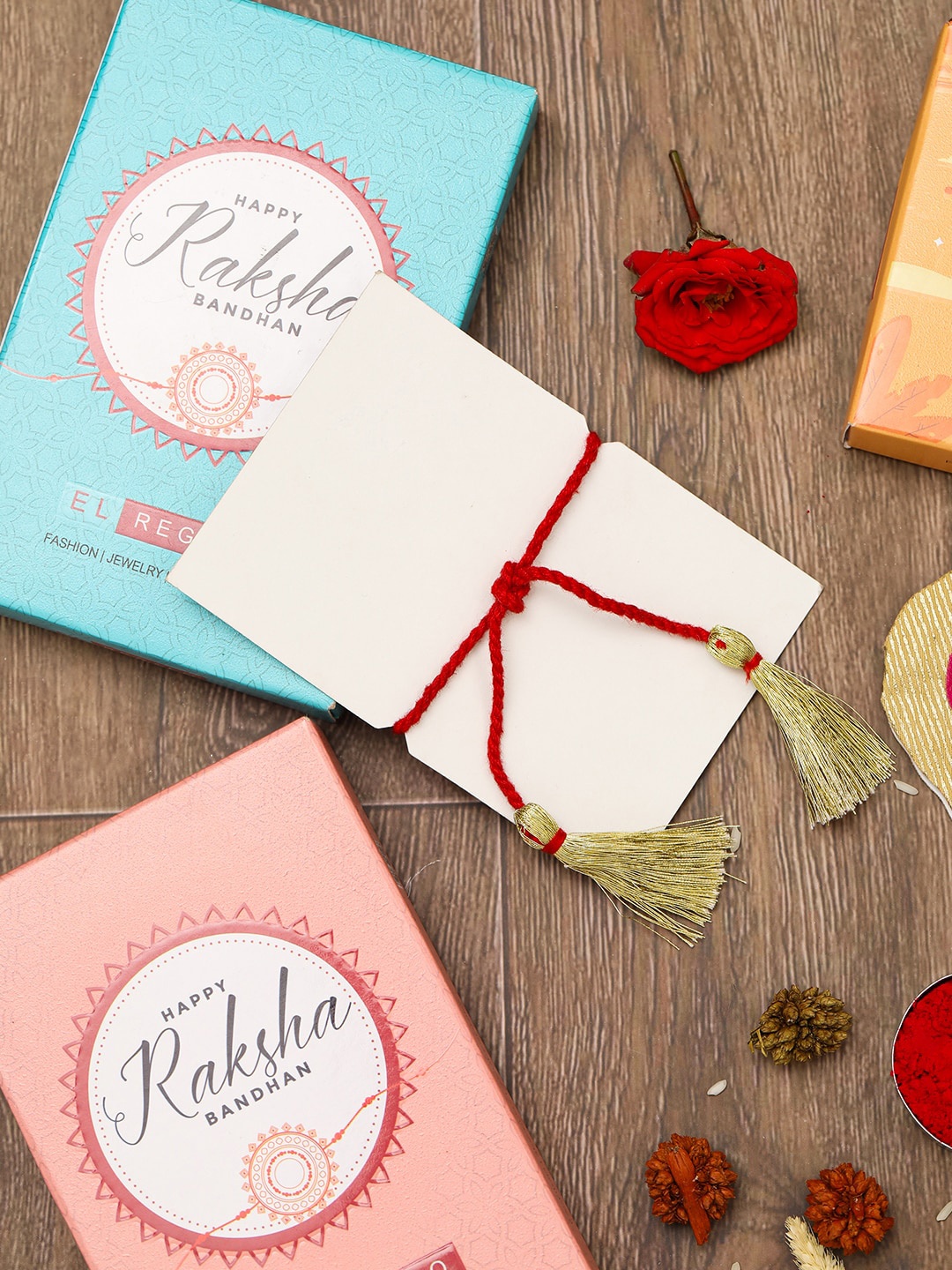 EL REGALO Studded Peacock Charm Thread Rakhis With Roli Chawl & Card Gift Set Box, Silver
EL REGALO Studded Peacock Charm Thread Rakhis With Roli Chawl & Card Gift Set Box, Silver