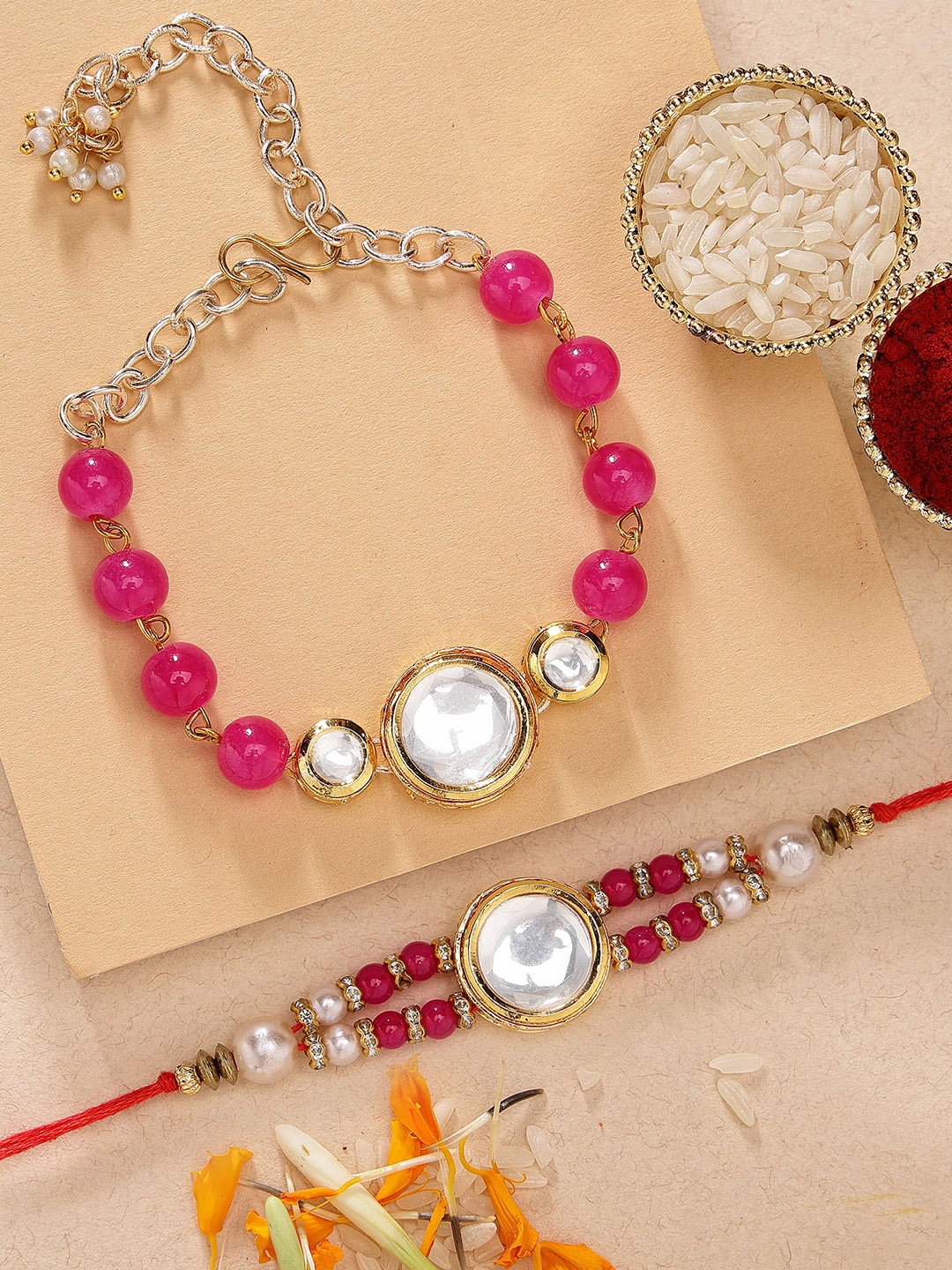 KARATCART Set of 2 Gold Plated Polki Kundan Bhaiya Bhabhi Rakhi with Roli & Chawal Combo, Pink
KARATCART Set of 2 Gold Plated Polki Kundan Bhaiya Bhabhi Rakhi with Roli & Chawal Combo, Pink