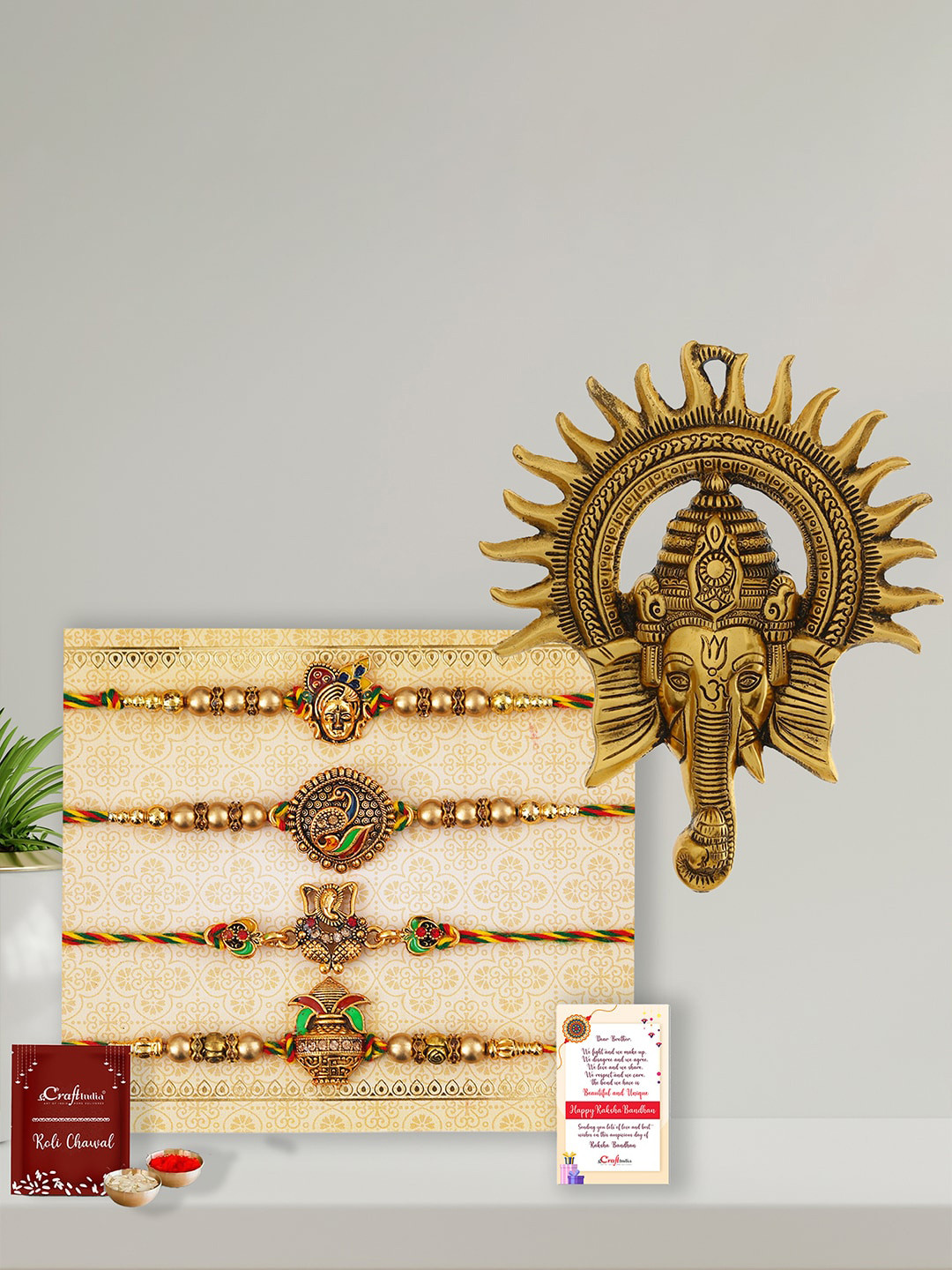 eCraftIndia Unisex Set of 4 Pearl Rakhis with Roli Chawal Card & Ganesha Wall Hanging, Gold
eCraftIndia Unisex Set of 4 Pearl Rakhis with Roli Chawal Card & Ganesha Wall Hanging, Gold