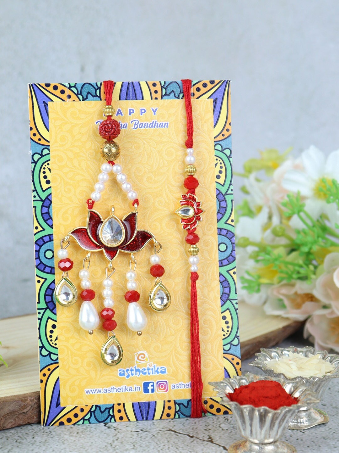 Asthetika Unisex Set Of 2 Kundan Studded Thread Rakhis With Roli Chawal & Greeting Card, Red
Asthetika Unisex Set Of 2 Kundan Studded Thread Rakhis With Roli Chawal & Greeting Card, Red
