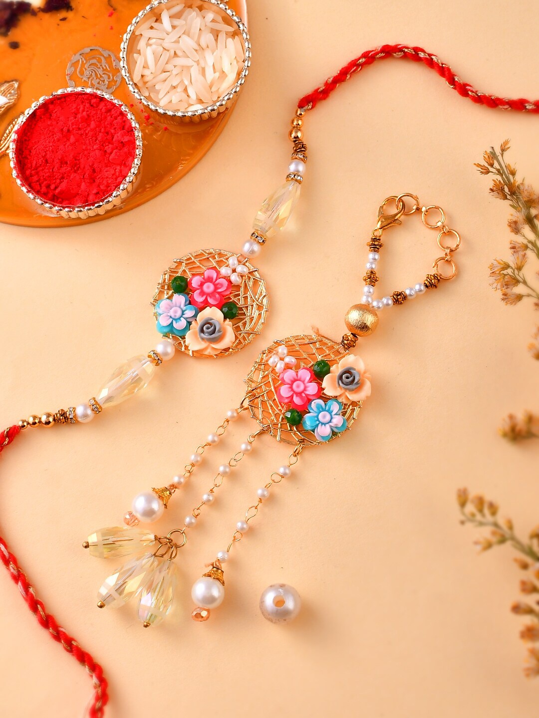 Aapno Rajasthan Unisex Metal & Pearl Flower Embellished Bhaiya Bhabhi Rakhi Gift Set, Red
Aapno Rajasthan Unisex Metal & Pearl Flower Embellished Bhaiya Bhabhi Rakhi Gift Set, Red