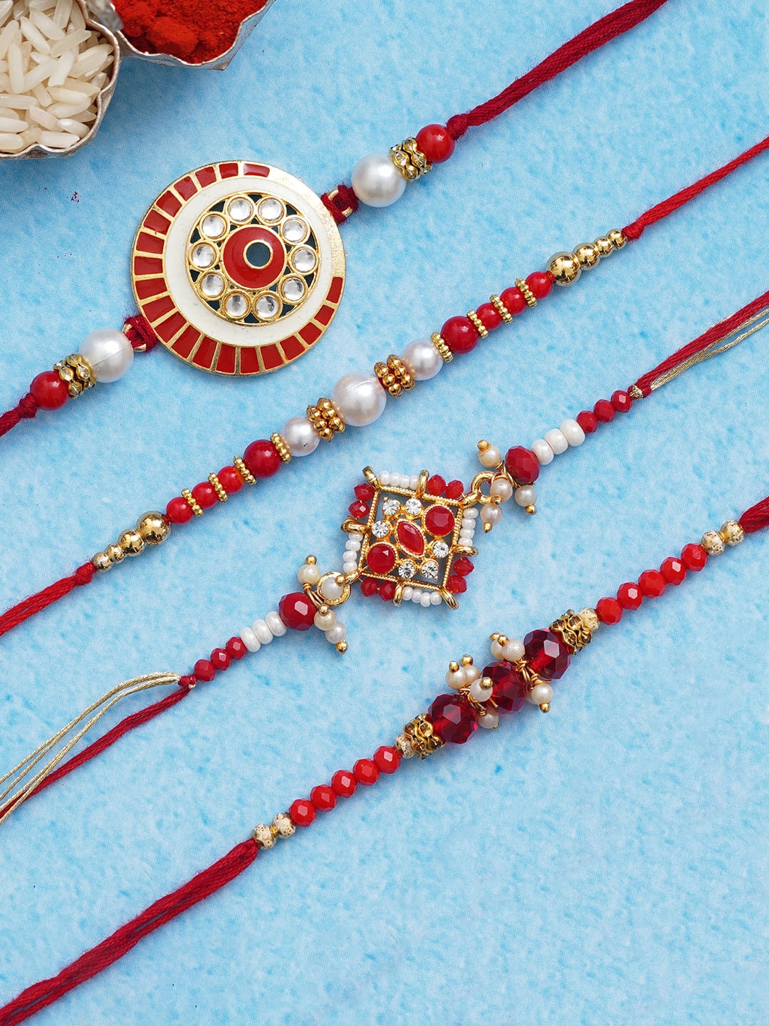 eCraftIndia Set of 4 Red & Golden Beads & Pearls Designer Rakhis With Roli Chawal Pack
eCraftIndia Set of 4 Red & Golden Beads & Pearls Designer Rakhis With Roli Chawal Pack
