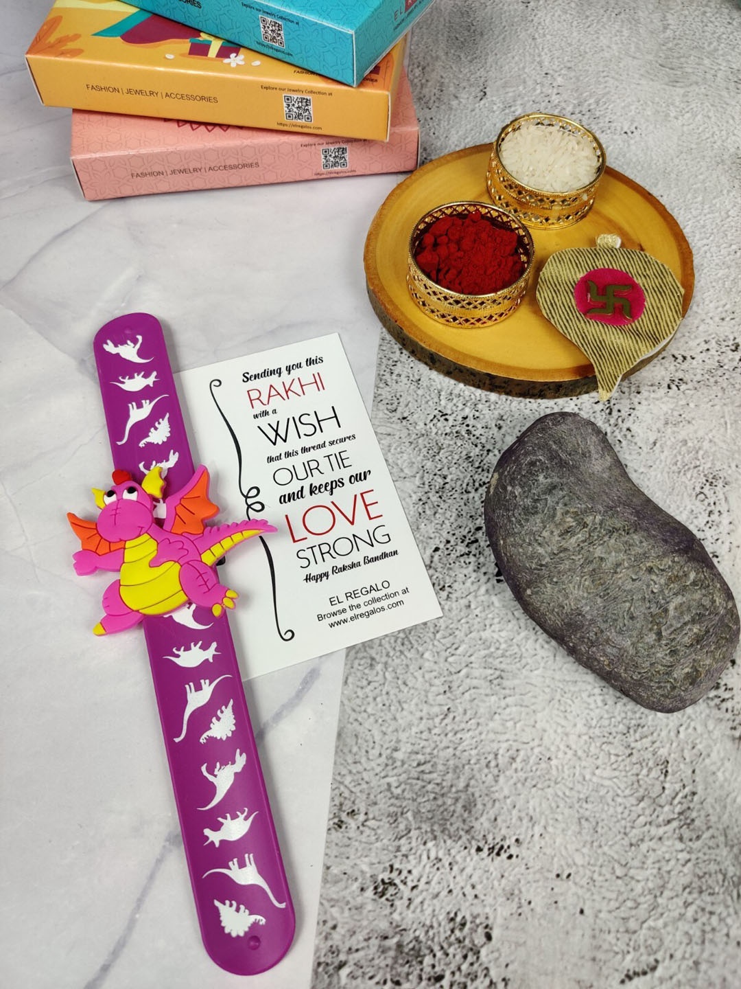 EL REGALO Kids Dinosaur Design Slap Band Rakhi With Roli Chawal & Greeting Card, Purple
EL REGALO Kids Dinosaur Design Slap Band Rakhi With Roli Chawal & Greeting Card, Purple