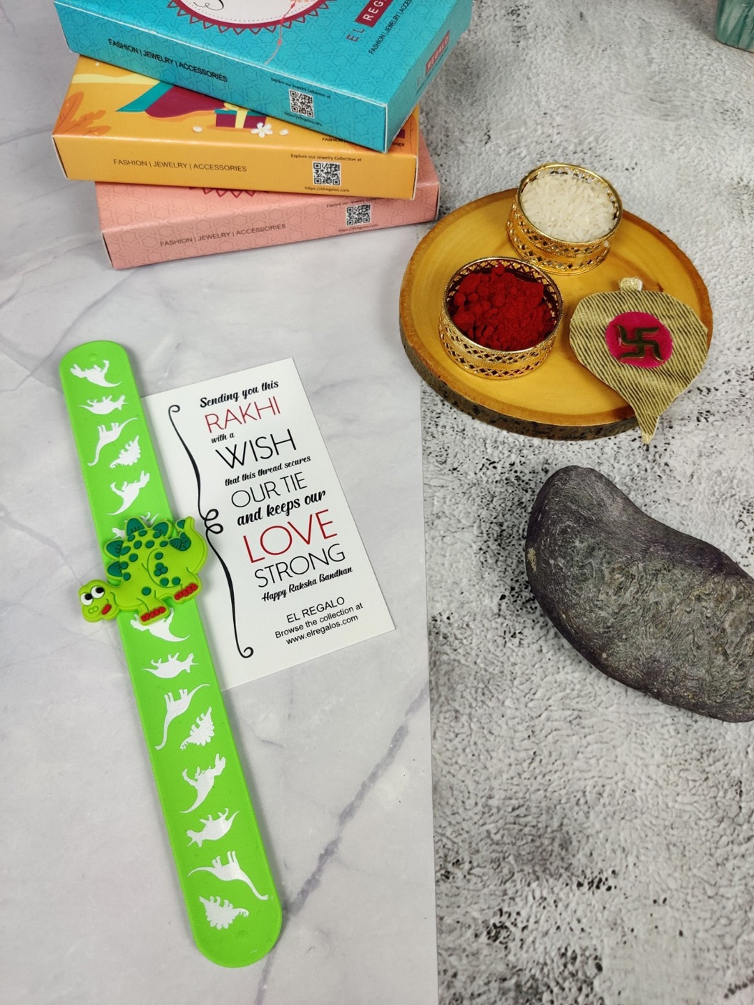 EL REGALO Kids Dinosaur Design Slap Band Rakhi With Roli Chawl & Card Gift Set, Green
EL REGALO Kids Dinosaur Design Slap Band Rakhi With Roli Chawl & Card Gift Set, Green
