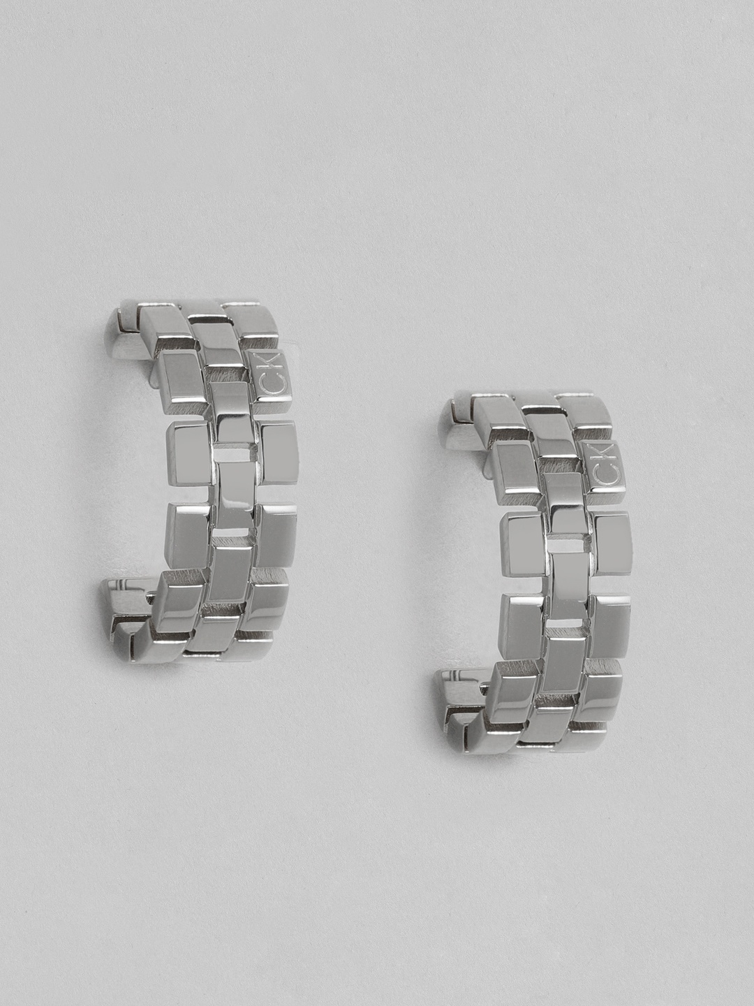 Calvin Klein Textured Brass Plated Classic Stainless Steel Half Hoop Earrings, Silver
Calvin Klein Textured Brass Plated Classic Stainless Steel Half Hoop Earrings, Silver
