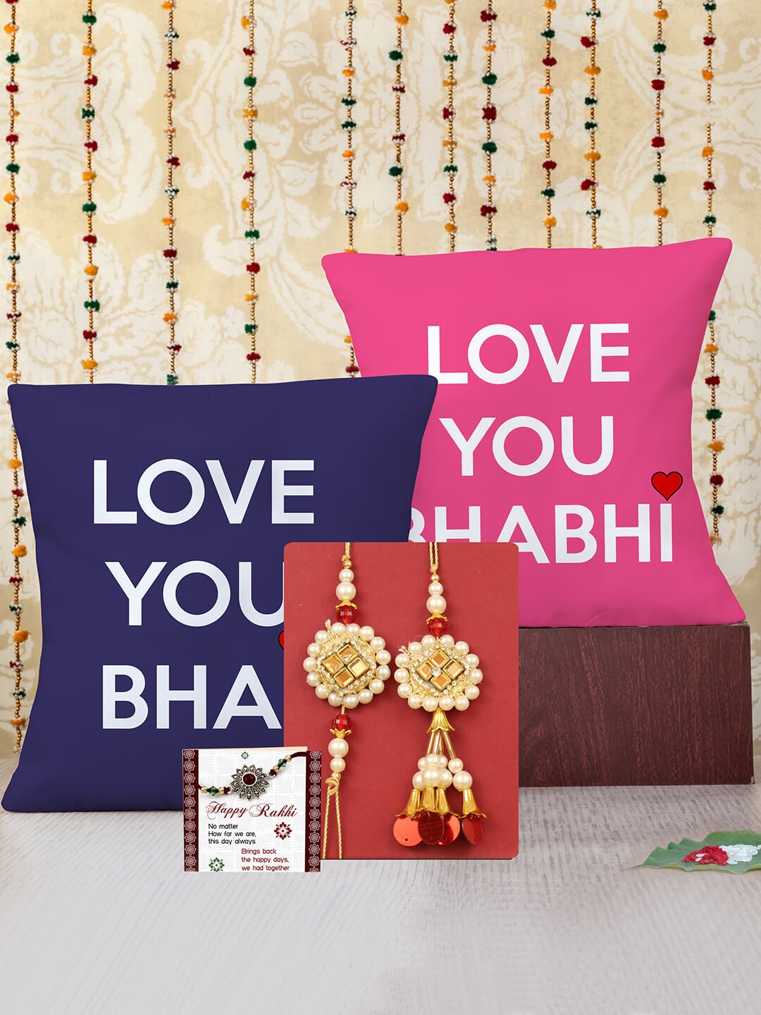 TIED RIBBONS Unisex Set Of 2 Stone Studded Bhaiya Bhabhi Rakhi Gift Set With 2 Cushions, Red
TIED RIBBONS Unisex Set Of 2 Stone Studded Bhaiya Bhabhi Rakhi Gift Set With 2 Cushions, Red
