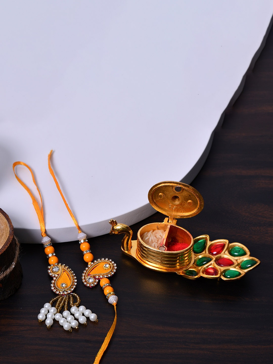 Fashion Bizz Unisex Set of 2 Thread Rakhi with Kumkum & Peacock-Shaped Roli-Chawal Holder, Gold
Fashion Bizz Unisex Set of 2 Thread Rakhi with Kumkum & Peacock-Shaped Roli-Chawal Holder, Gold