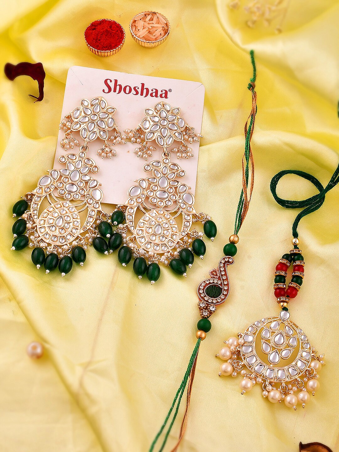 Shoshaa Kundan Bhaiya Bhabhi Rakhi Lumba Maangtika With Roli Chawal Earrings Gift Set, Red
Shoshaa Kundan Bhaiya Bhabhi Rakhi Lumba Maangtika With Roli Chawal Earrings Gift Set, Red