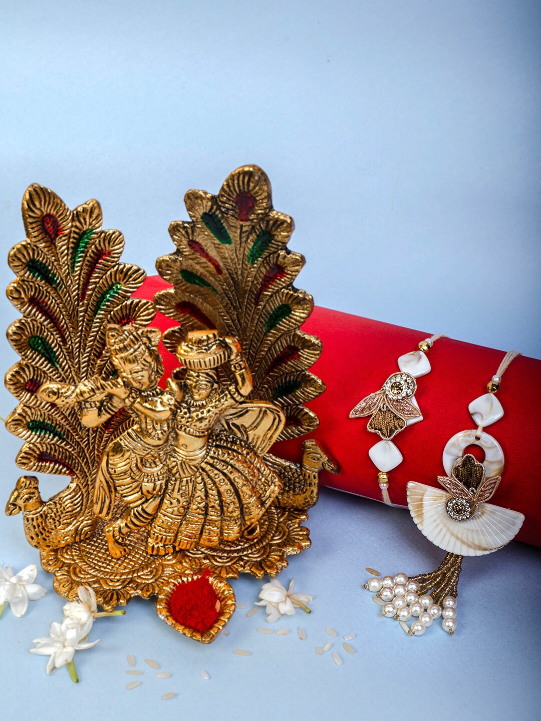 PANASH- Gift Set Of Radha Krishna Bhiaya Bhabhi Rakhis with Showpiece and Roli Chawal, Gold
PANASH- Gift Set Of Radha Krishna Bhiaya Bhabhi Rakhis with Showpiece and Roli Chawal, Gold