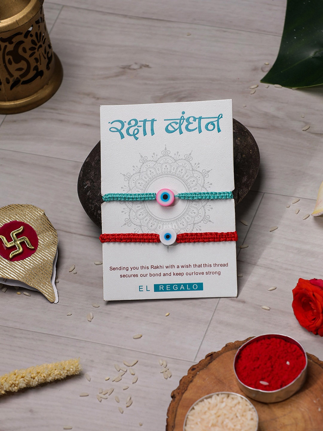 EL REGALO Bhaiya Bhabhi Set Of 2 Wraparound Rakhi With Roli And Chawal, Turquoise blue
EL REGALO Bhaiya Bhabhi Set Of 2 Wraparound Rakhi With Roli And Chawal, Turquoise blue