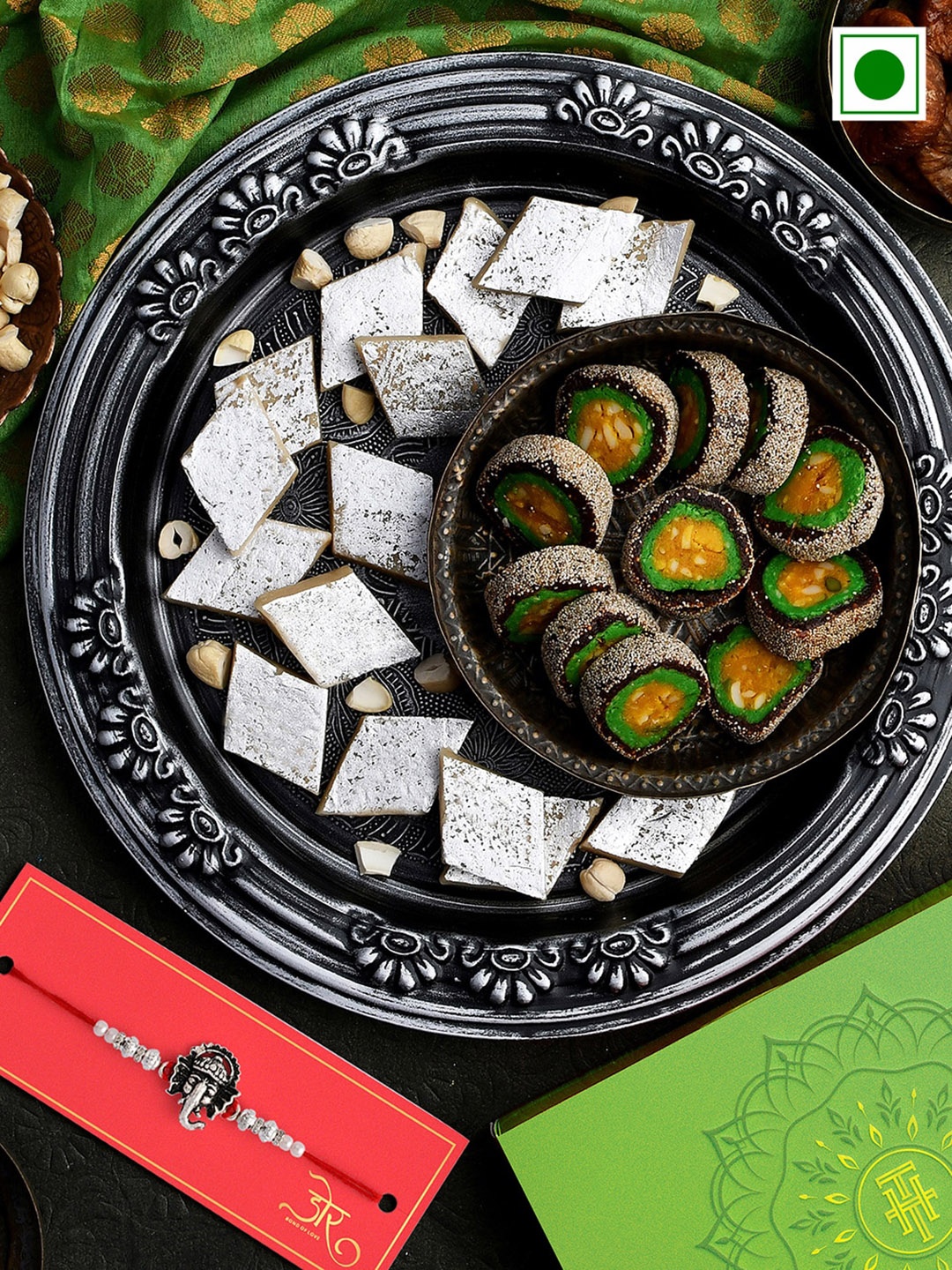 RawFruit Ganesh Charm Rakhi With Roli Chawal & Twin Delights Sweets-200 gms Each, Silver
RawFruit Ganesh Charm Rakhi With Roli Chawal & Twin Delights Sweets-200 gms Each, Silver