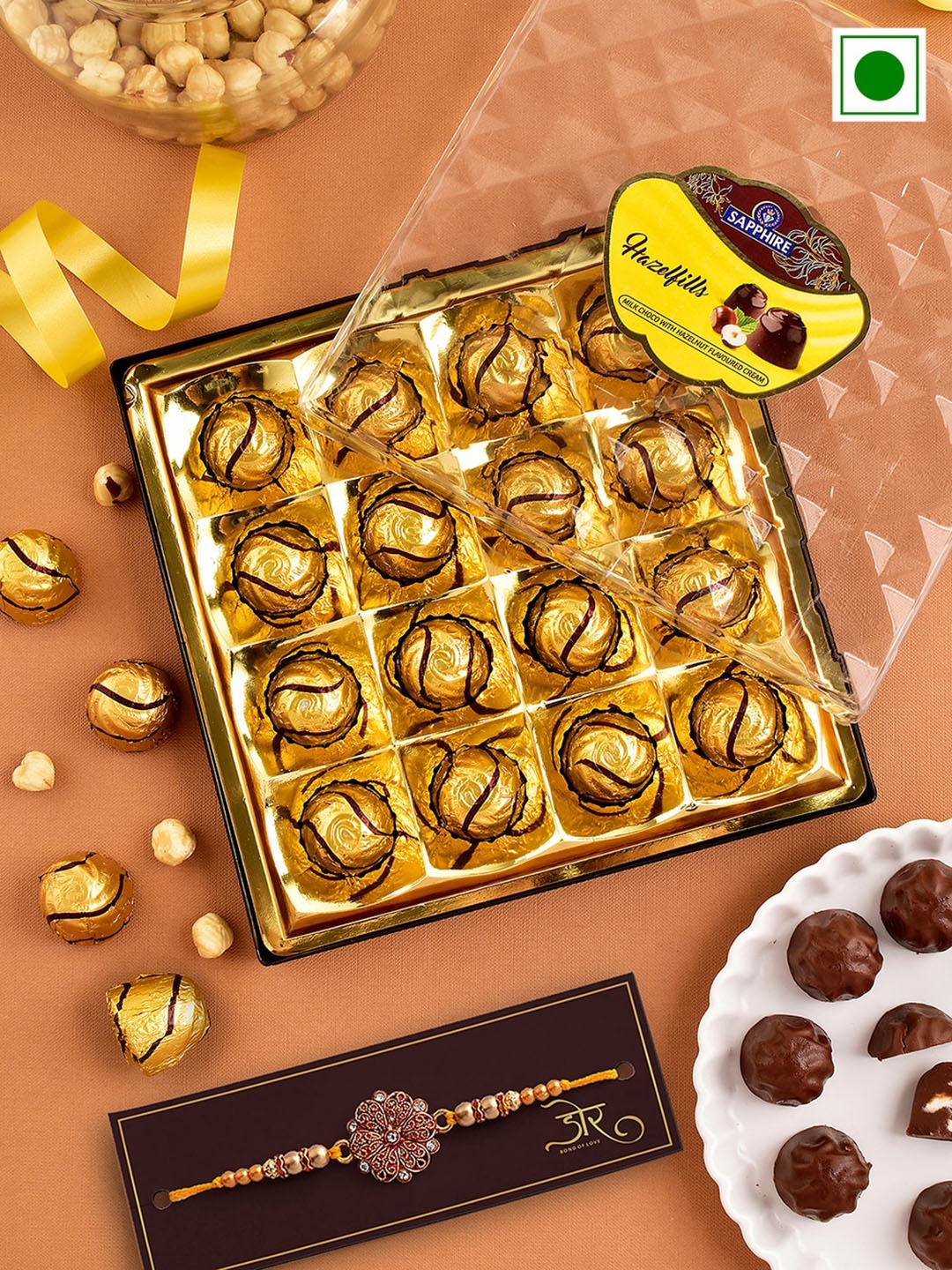 Hyperfoods Stones Studded & Beaded Rakhi With Sapphire Hazelfill Chocolate Gifts 215 g, Gold
Hyperfoods Stones Studded & Beaded Rakhi With Sapphire Hazelfill Chocolate Gifts 215 g, Gold