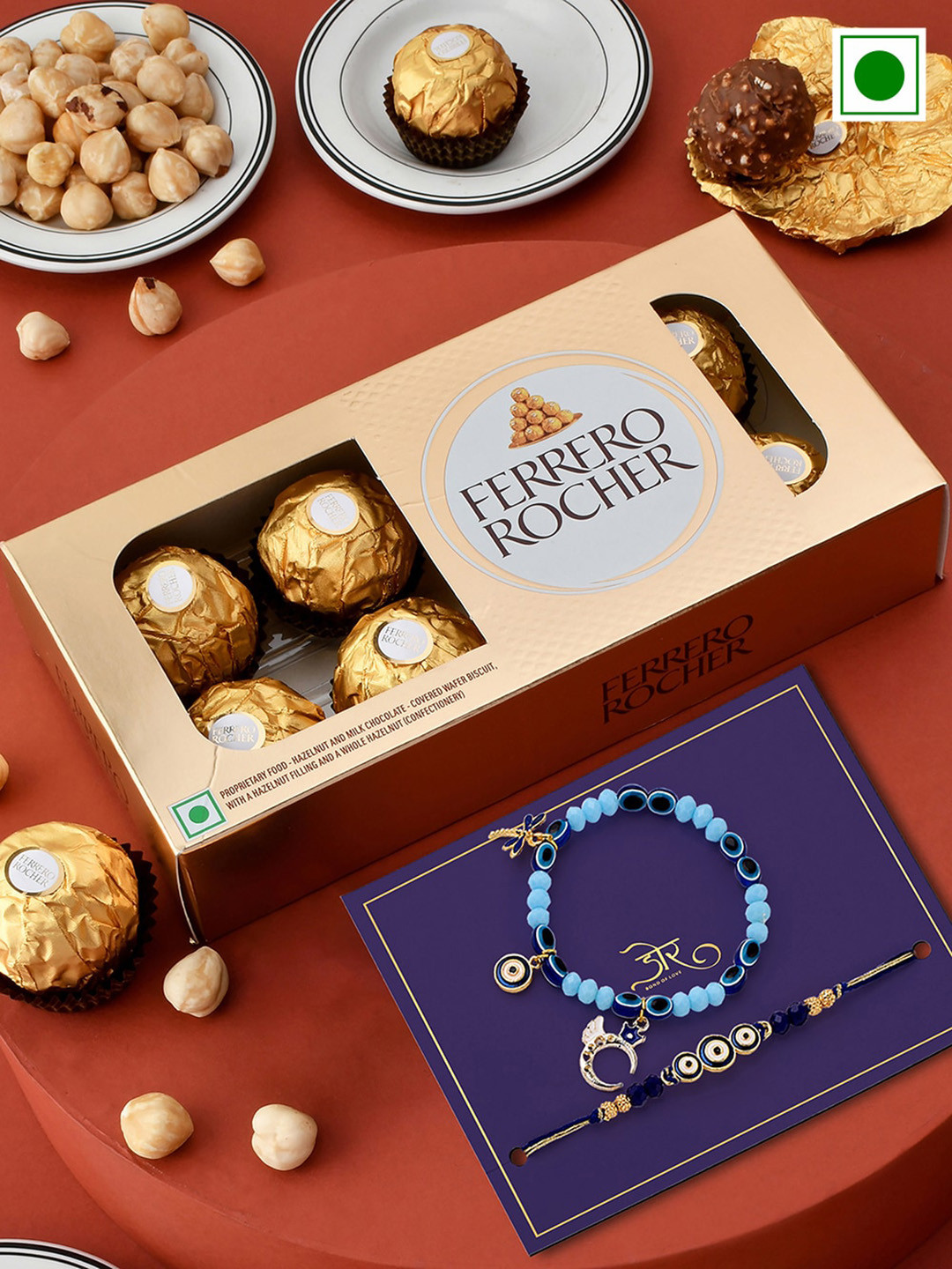 Hyperfoods Set Of 2 Evil Eye Charm Rakhis With Ferrero Rocher Chocolate Gifts 300 g, Blue
Hyperfoods Set Of 2 Evil Eye Charm Rakhis With Ferrero Rocher Chocolate Gifts 300 g, Blue