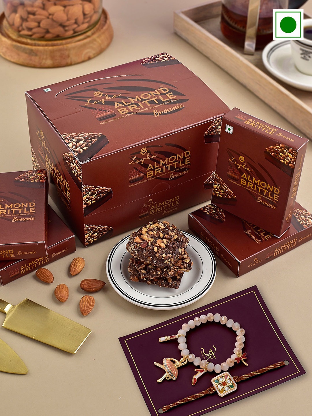 Hyperfoods Set Of 2 Stone-Studded Rakhis With Loyka Almond Brownie Chocolate 180gms, Brown
Hyperfoods Set Of 2 Stone-Studded Rakhis With Loyka Almond Brownie Chocolate 180gms, Brown