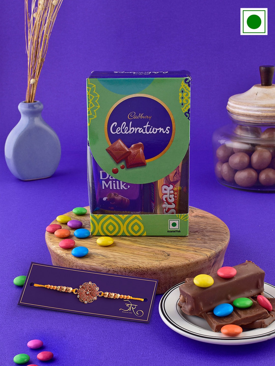 Hyperfoods Set Of 2 Stone-Studded Rakhis With Cadbury Celebrations Chocolate Set, Purple
Hyperfoods Set Of 2 Stone-Studded Rakhis With Cadbury Celebrations Chocolate Set, Purple