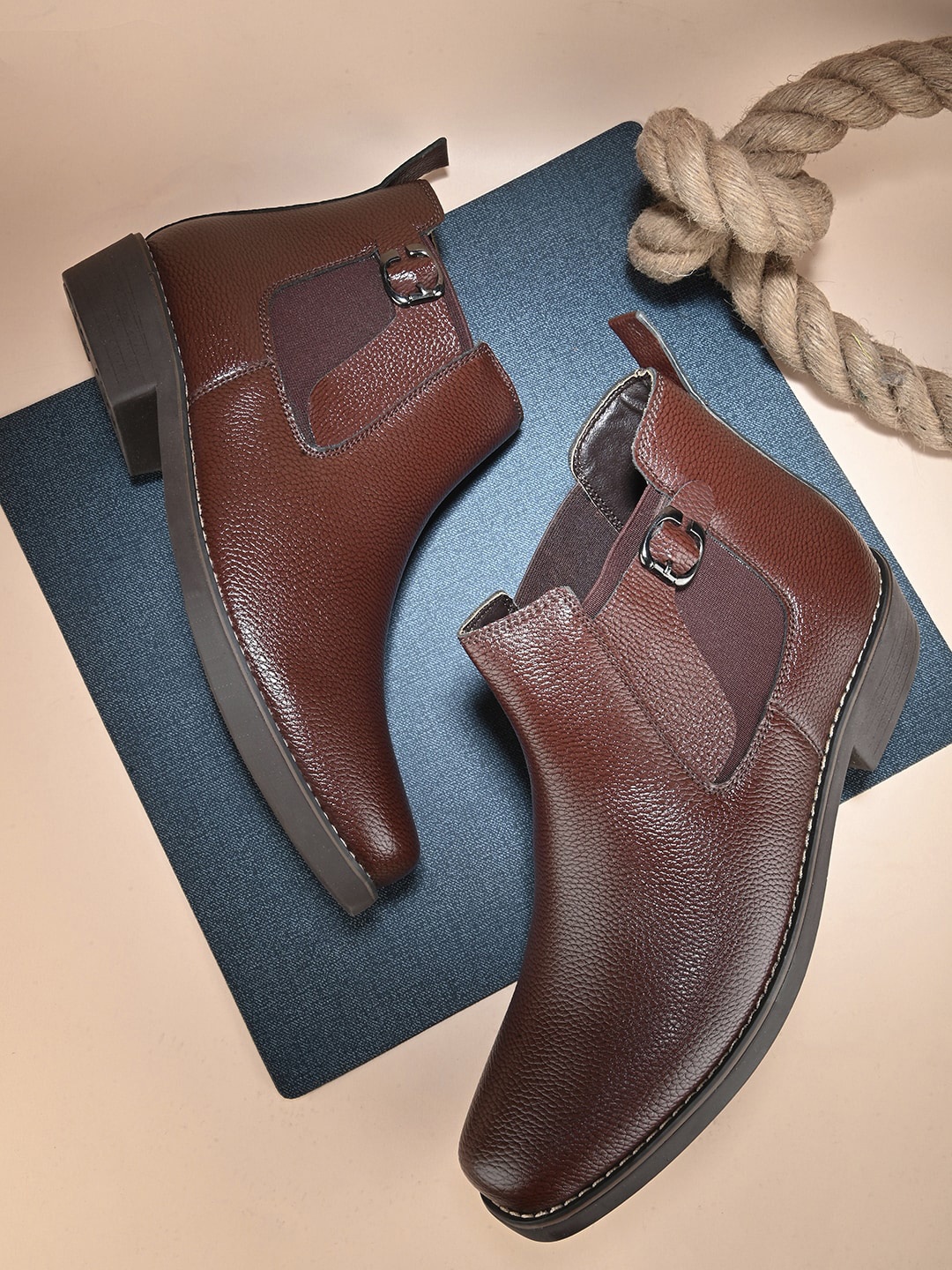 The Roadster Lifestyle Co. Men Brown Mid Top Block-Heel Chelsea Boots With Buckle Detail
The Roadster Lifestyle Co. Men Brown Mid Top Block-Heel Chelsea Boots With Buckle Detail