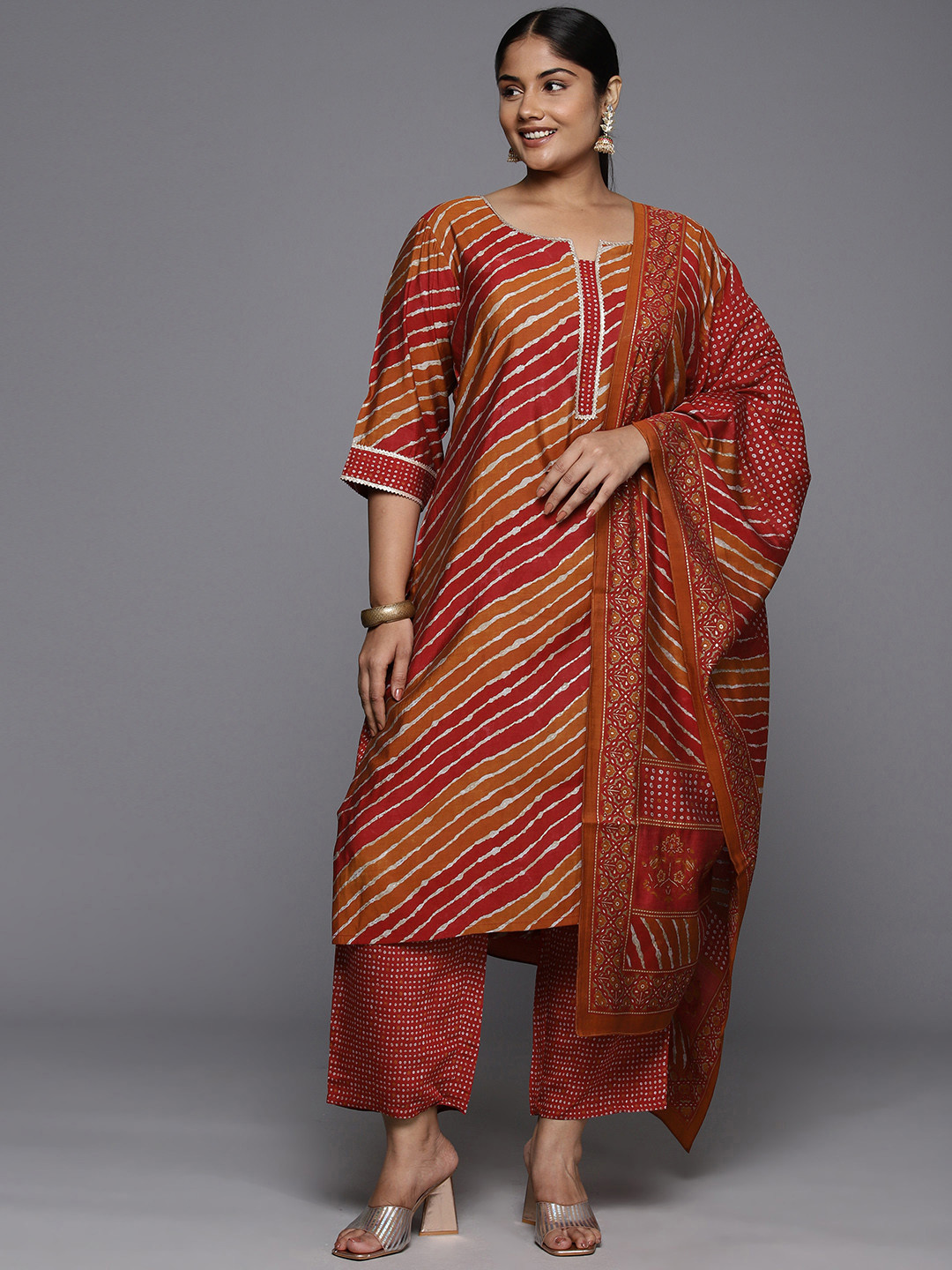 EXTRA LOVE BY LIBAS Plus Size Leheriya Printed Gotta Patti Kurta with Trousers & Dupatta, Red
EXTRA LOVE BY LIBAS Plus Size Leheriya Printed Gotta Patti Kurta with Trousers & Dupatta, Red