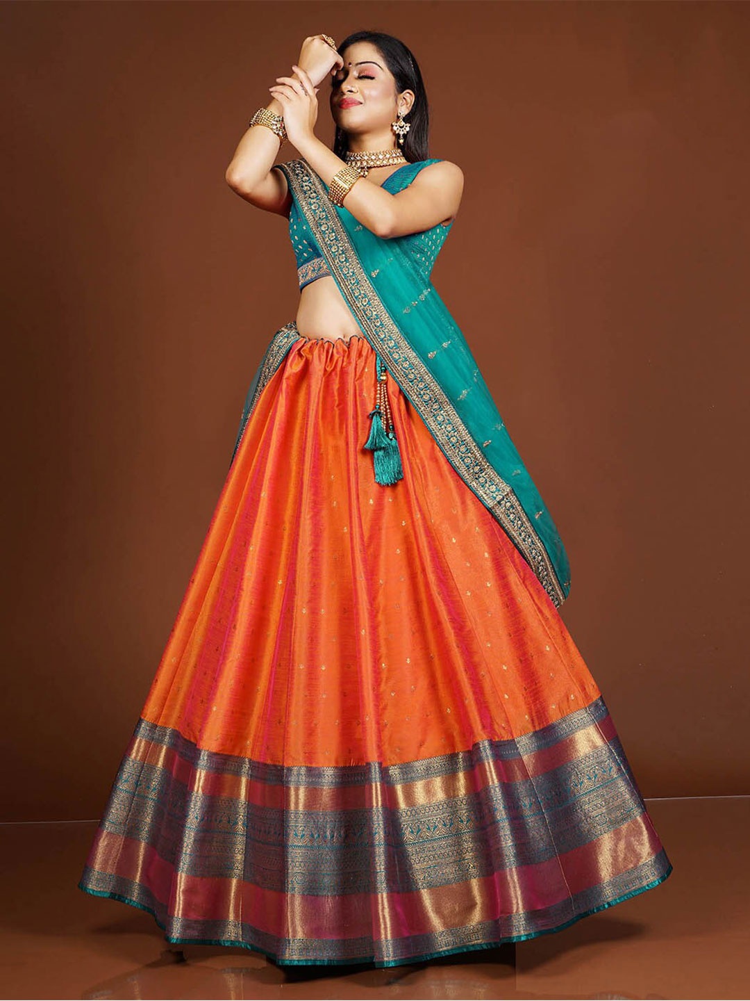 HALFSAREE STUDIO Orange & Teal Semi-Stitched Lehenga & Unstitched Blouse With Dupatta
HALFSAREE STUDIO Orange & Teal Semi-Stitched Lehenga & Unstitched Blouse With Dupatta