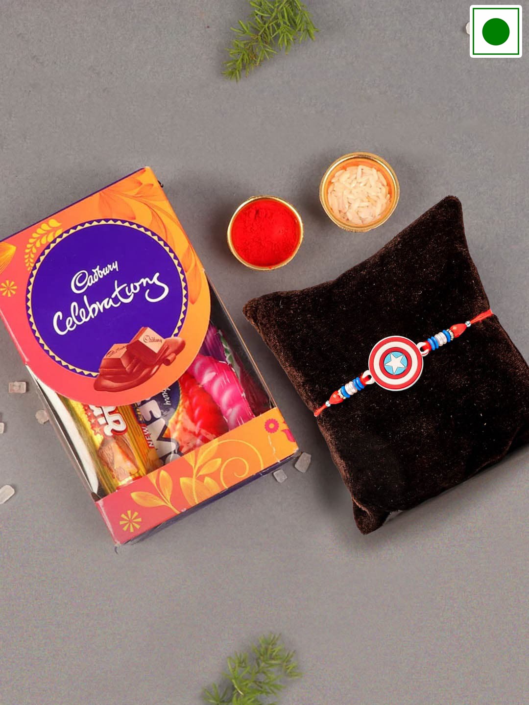 TIED RIBBONS Kids Capitan America Rakhi With Cadbury Celebration Chocolates Set -64.2 gms, Red
TIED RIBBONS Kids Capitan America Rakhi With Cadbury Celebration Chocolates Set -64.2 gms, Red