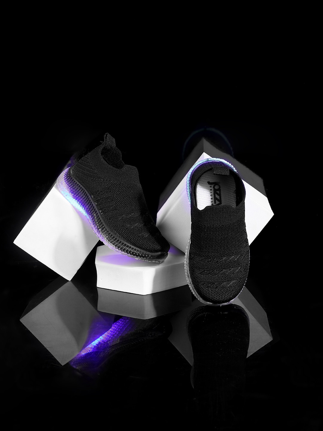 Jazzy Juniors Kids Textured Lightweight Mesh Slip-On Sneakers With LED Lights, Black
Jazzy Juniors Kids Textured Lightweight Mesh Slip-On Sneakers With LED Lights, Black