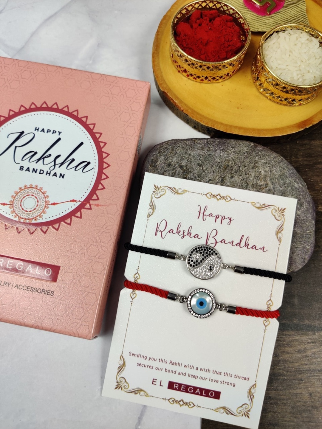EL REGALO Bhaiya Bhabhi Set Of 2 Wraparound Evil Eye Charm Rakhi Combo With Roli Chawal Card, Red
EL REGALO Bhaiya Bhabhi Set Of 2 Wraparound Evil Eye Charm Rakhi Combo With Roli Chawal Card, Red