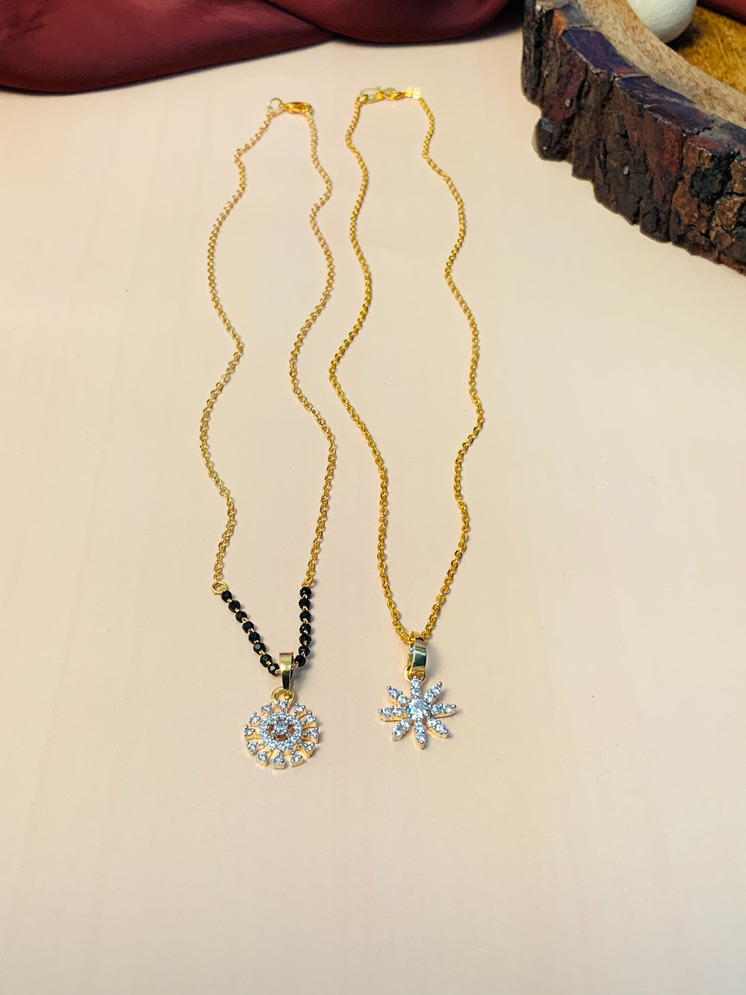 ABDESIGNS Set of 2 Gold-Plated AD-Studded & Beaded Mangalsutra & Pendant Chain
ABDESIGNS Set of 2 Gold-Plated AD-Studded & Beaded Mangalsutra & Pendant Chain