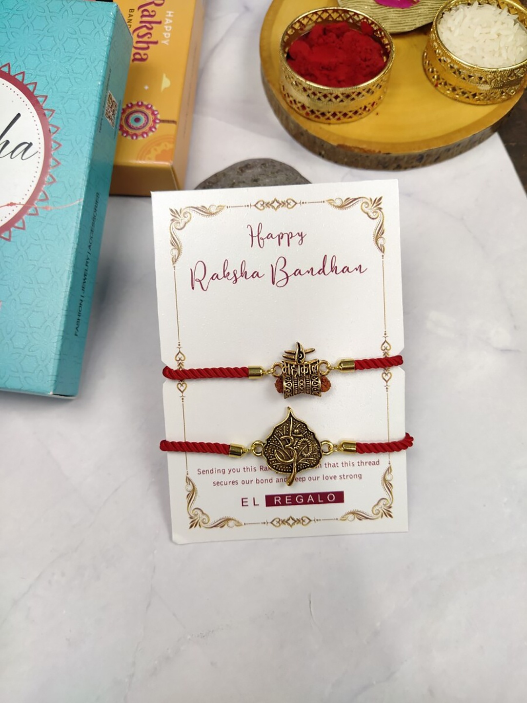 EL REGALO Bhaiya Bhabhi Set Of 2 Charm Rakhi Combo With Roli Chawal, Red
EL REGALO Bhaiya Bhabhi Set Of 2 Charm Rakhi Combo With Roli Chawal, Red