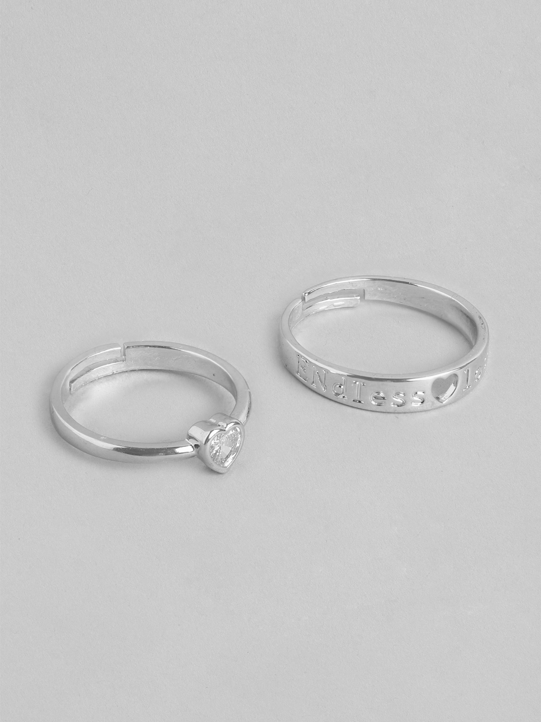 PARIS HAMILTON Set Of 2 Heart Shaped Silver-Plated CZ Stainless Steel Couple Finger Rings
PARIS HAMILTON Set Of 2 Heart Shaped Silver-Plated CZ Stainless Steel Couple Finger Rings