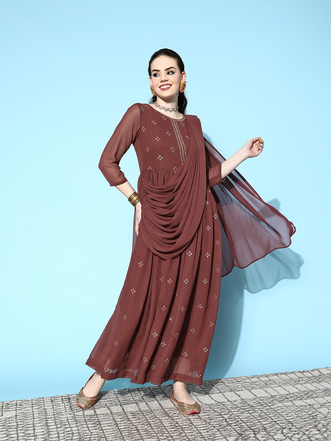 Ishin Ethnic Motifs Embroidered Gathered Georgette Fit & Flare Maxi Ethnic Dress, Brown
Ishin Ethnic Motifs Embroidered Gathered Georgette Fit & Flare Maxi Ethnic Dress, Brown