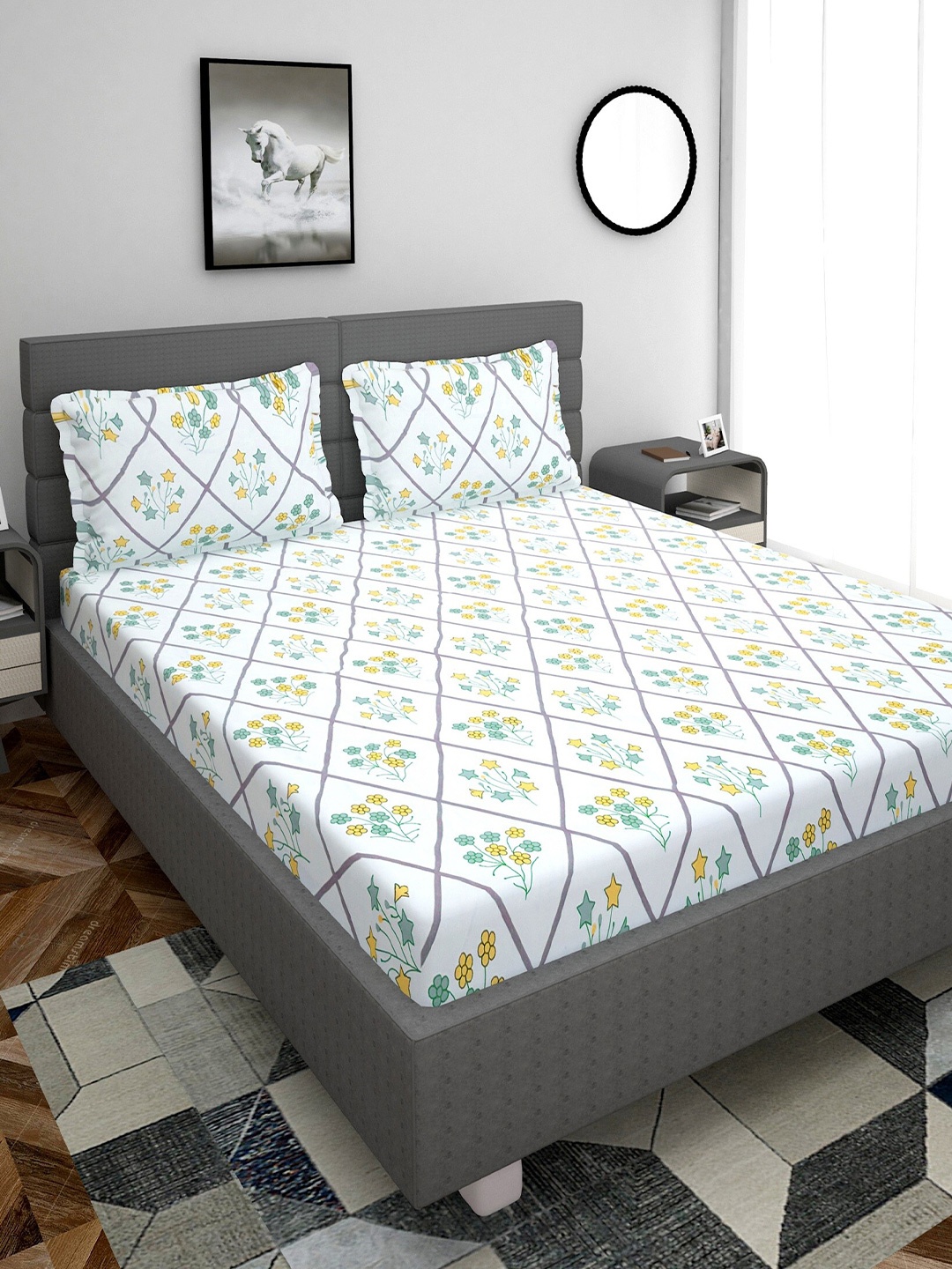 Stylespace by Isha White & Green Floral Cotton 250 TC King Bedsheet With 2 Pillow Covers
Stylespace by Isha White & Green Floral Cotton 250 TC King Bedsheet With 2 Pillow Covers