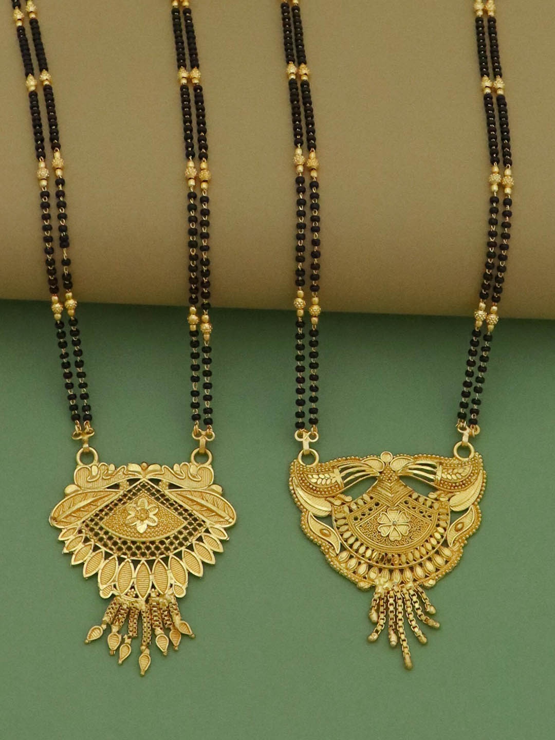 Ramdev Art Fashion Jwellery Pack Of 2 Gold-Plated Stone-Studded & Beaded Mangalsutra
Ramdev Art Fashion Jwellery Pack Of 2 Gold-Plated Stone-Studded & Beaded Mangalsutra