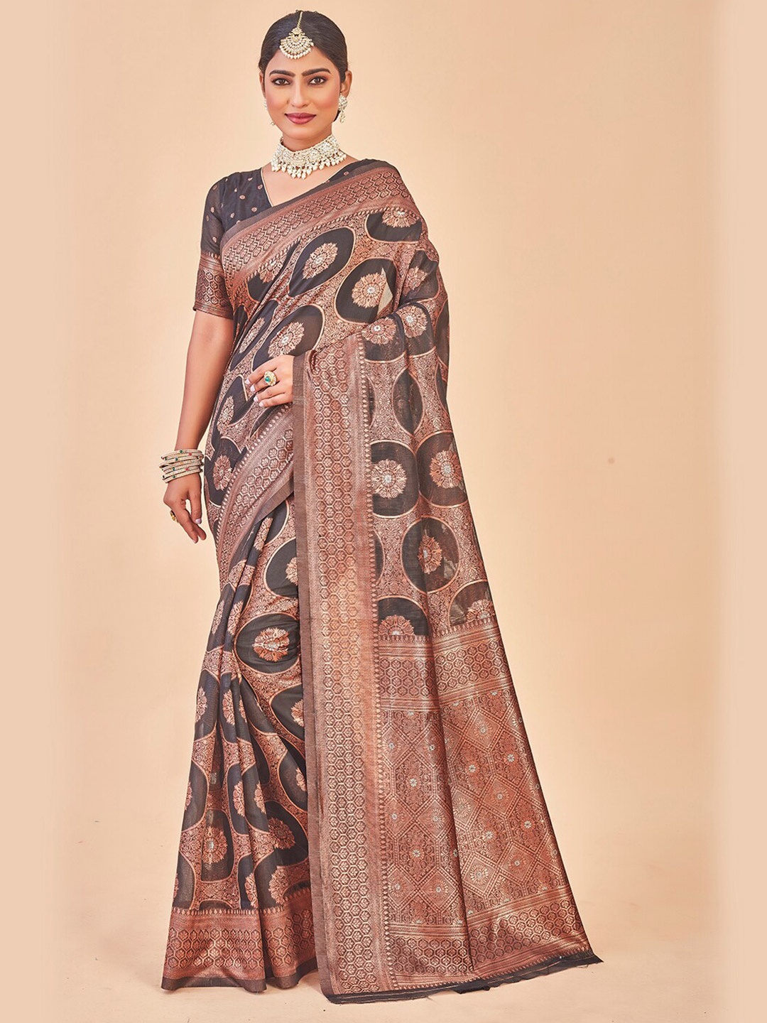 Anouk Rustic Black & Gold-Toned Ethnic Motifs Woven Design Zari Kanjeevaram Saree
Anouk Rustic Black & Gold-Toned Ethnic Motifs Woven Design Zari Kanjeevaram Saree