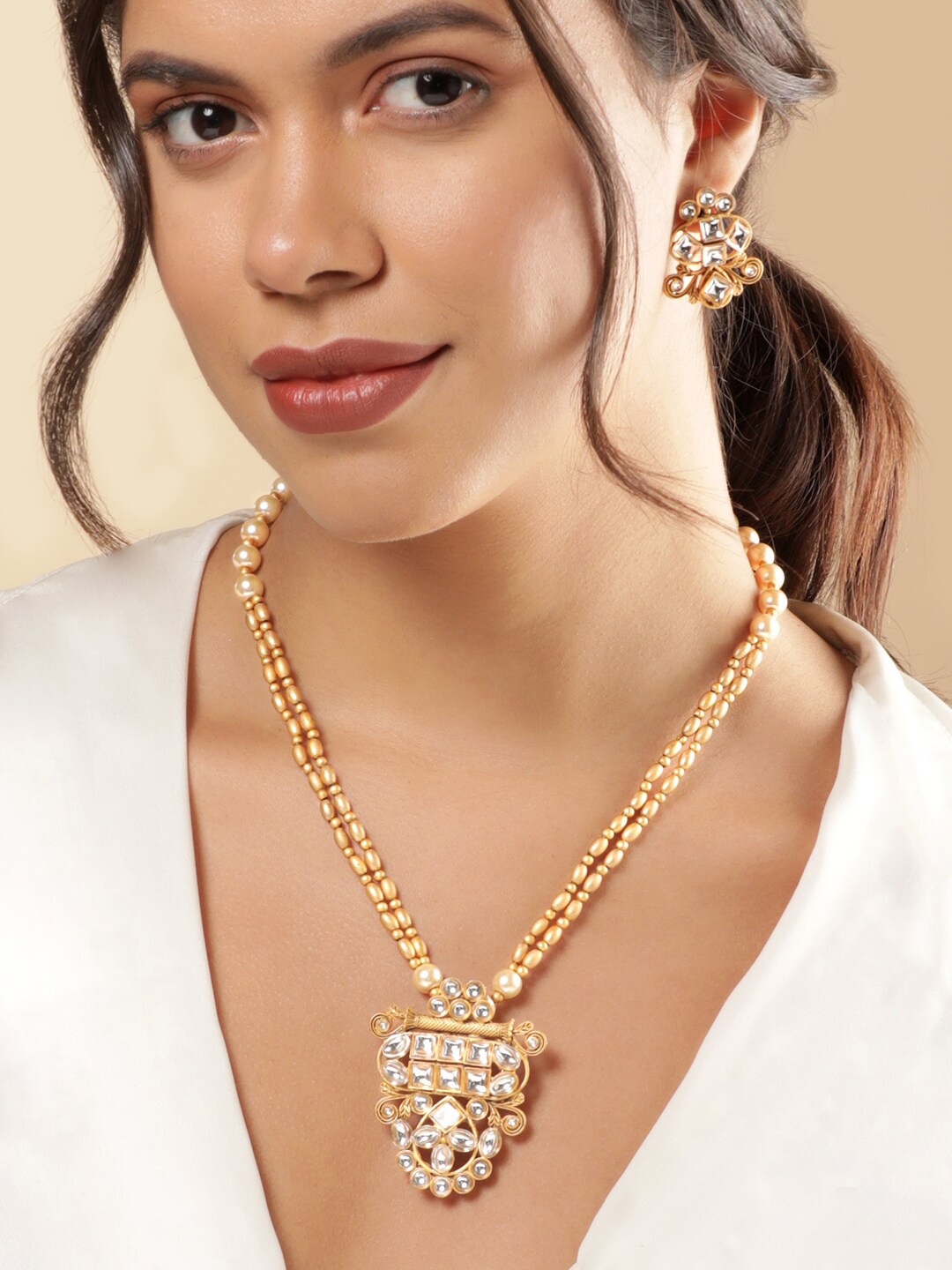 Rubans 18K Gold Plated Handcrafted Kundan Studded and Gold & Pearl Beaded Jewellery Set
Rubans 18K Gold Plated Handcrafted Kundan Studded and Gold & Pearl Beaded Jewellery Set