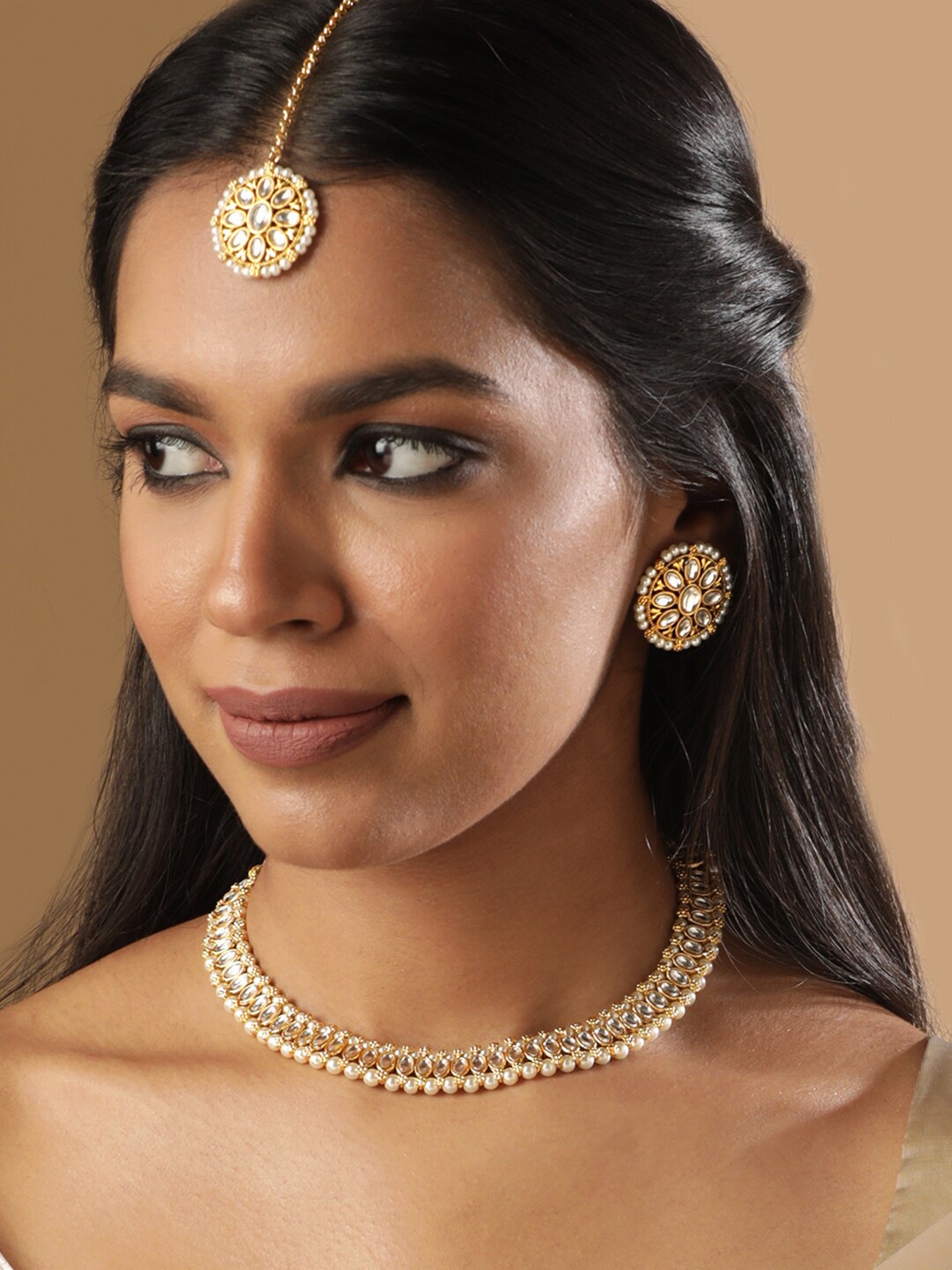 Rubans 18K Gold Plated Kundan Studded Pearl Beaded Choker Jewellery Sets with Maangtikka
Rubans 18K Gold Plated Kundan Studded Pearl Beaded Choker Jewellery Sets with Maangtikka